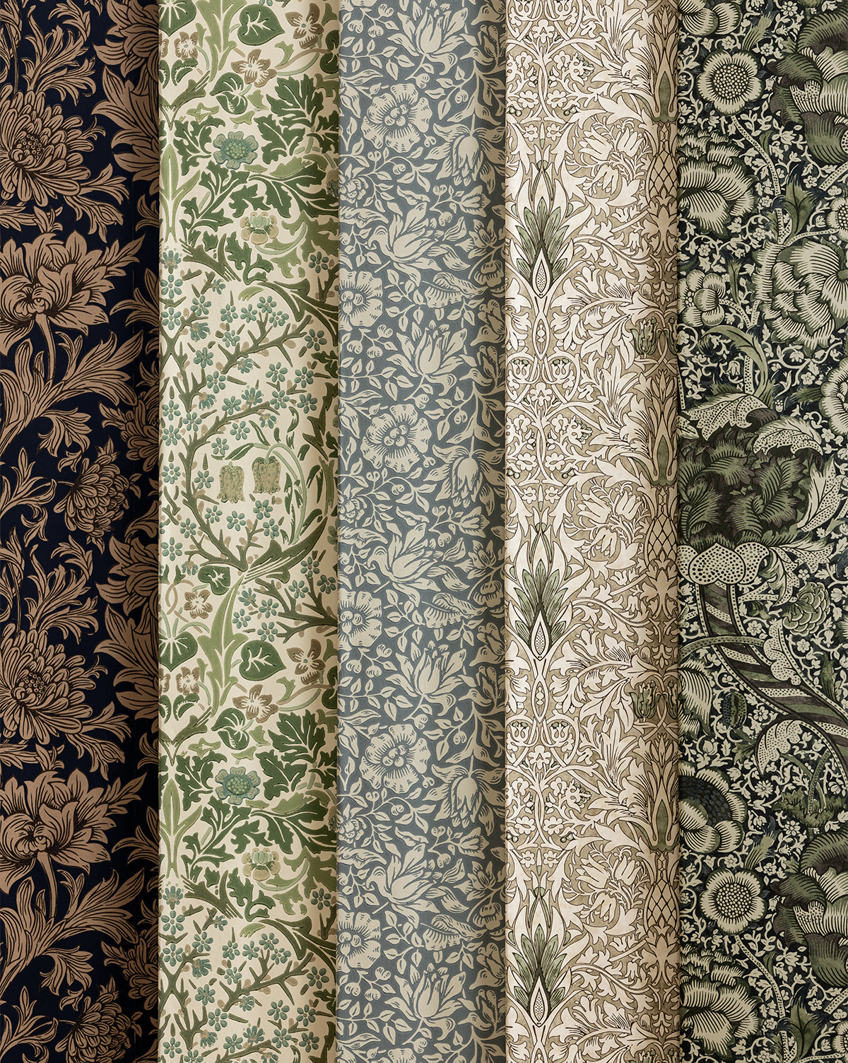 Five rolls of Morris & Co. x McGee & Co. Mallow Wallpaper by Sanderson Design Group, Inc., featuring vintage floral and botanical designs in navy, green, blue, beige, and brown, are displayed vertically side by side—McGee & Co.