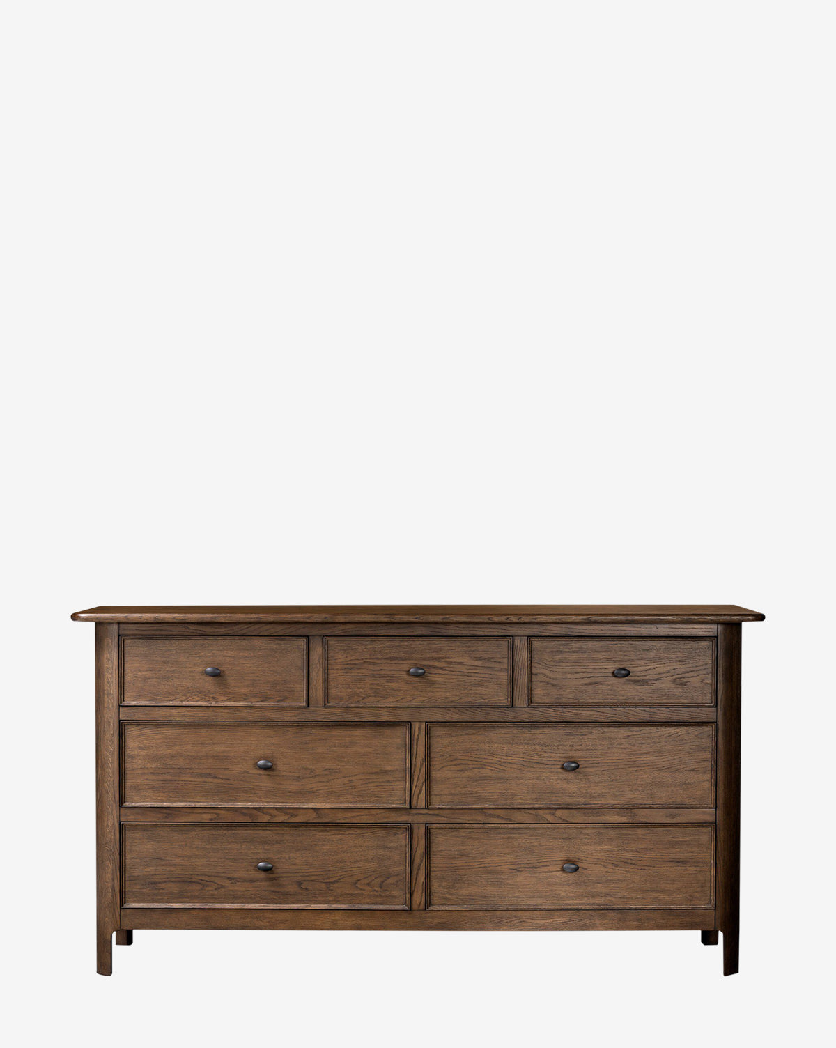The Four Hands Aeris Dresser is a wooden dresser with seven drawers—three small above four large—round metal knobs, a simple rustic style, and a natural finish, ideal for bedroom storage. McGee & Co.