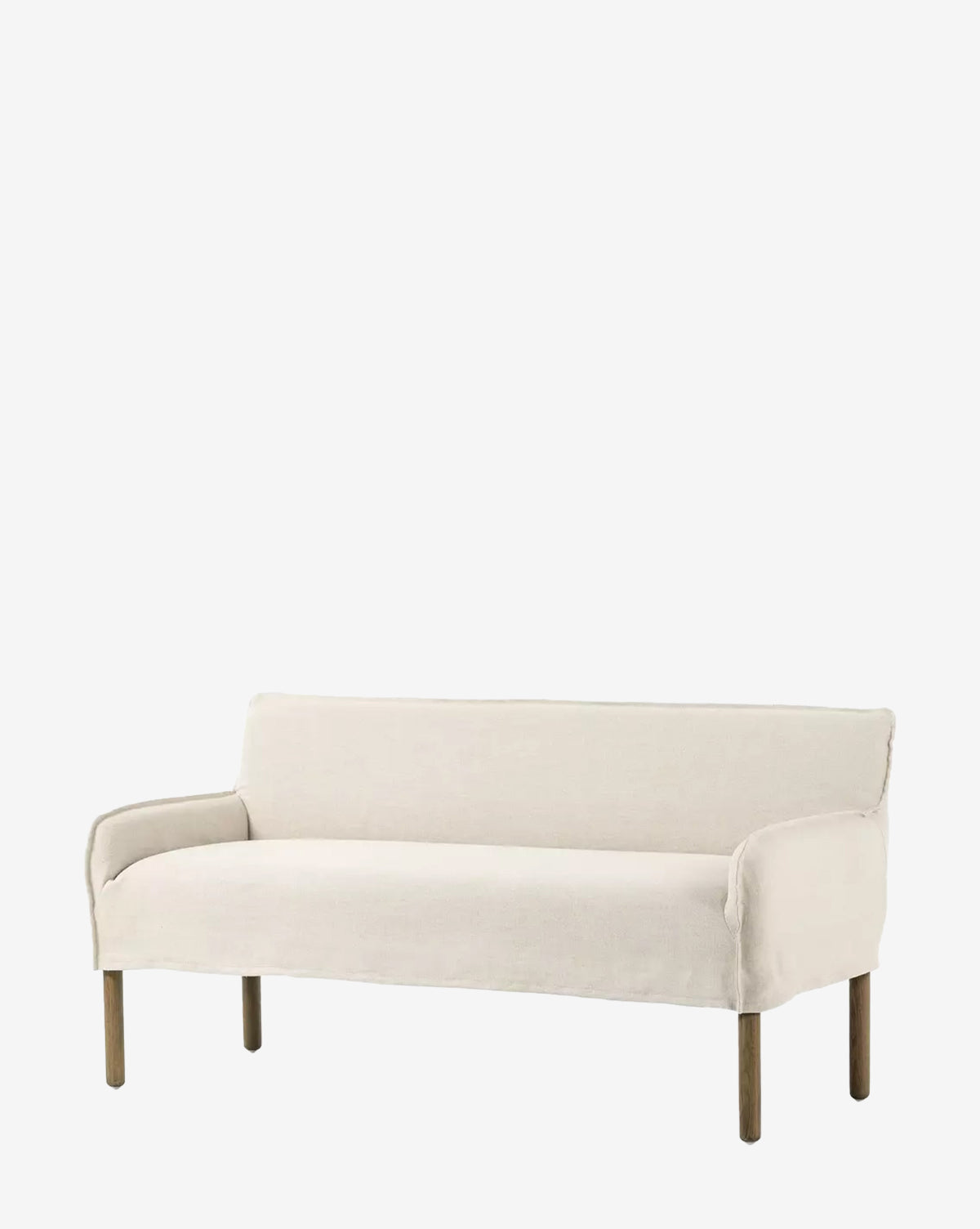 The Aiken Slipcover Bench is a minimalist beige seat with wooden legs and a cushioned surface, designed with clean lines and a low backrest, shown on a plain white background by McGee & Co.