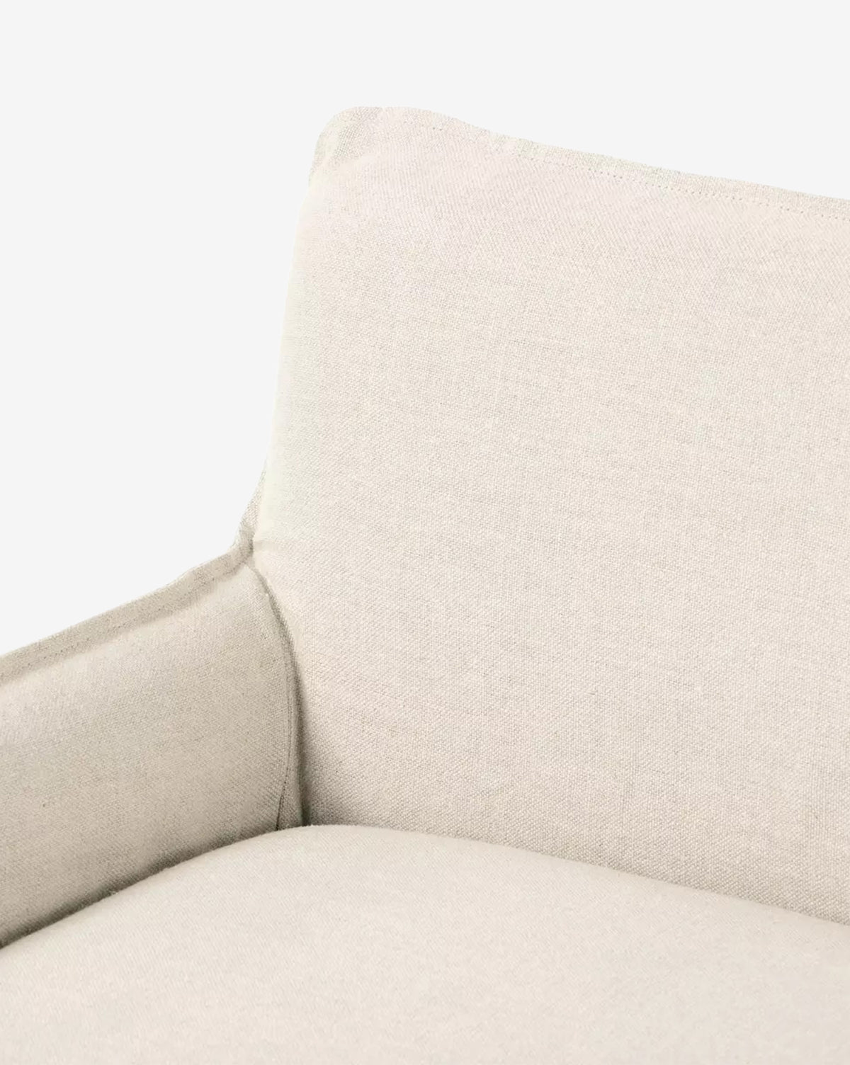 Close-up view of the Aiken Slipcover Bench in light beige linen, highlighting its backrest, seat, and part of the armrest against a plain white background, by McGee & Co.
