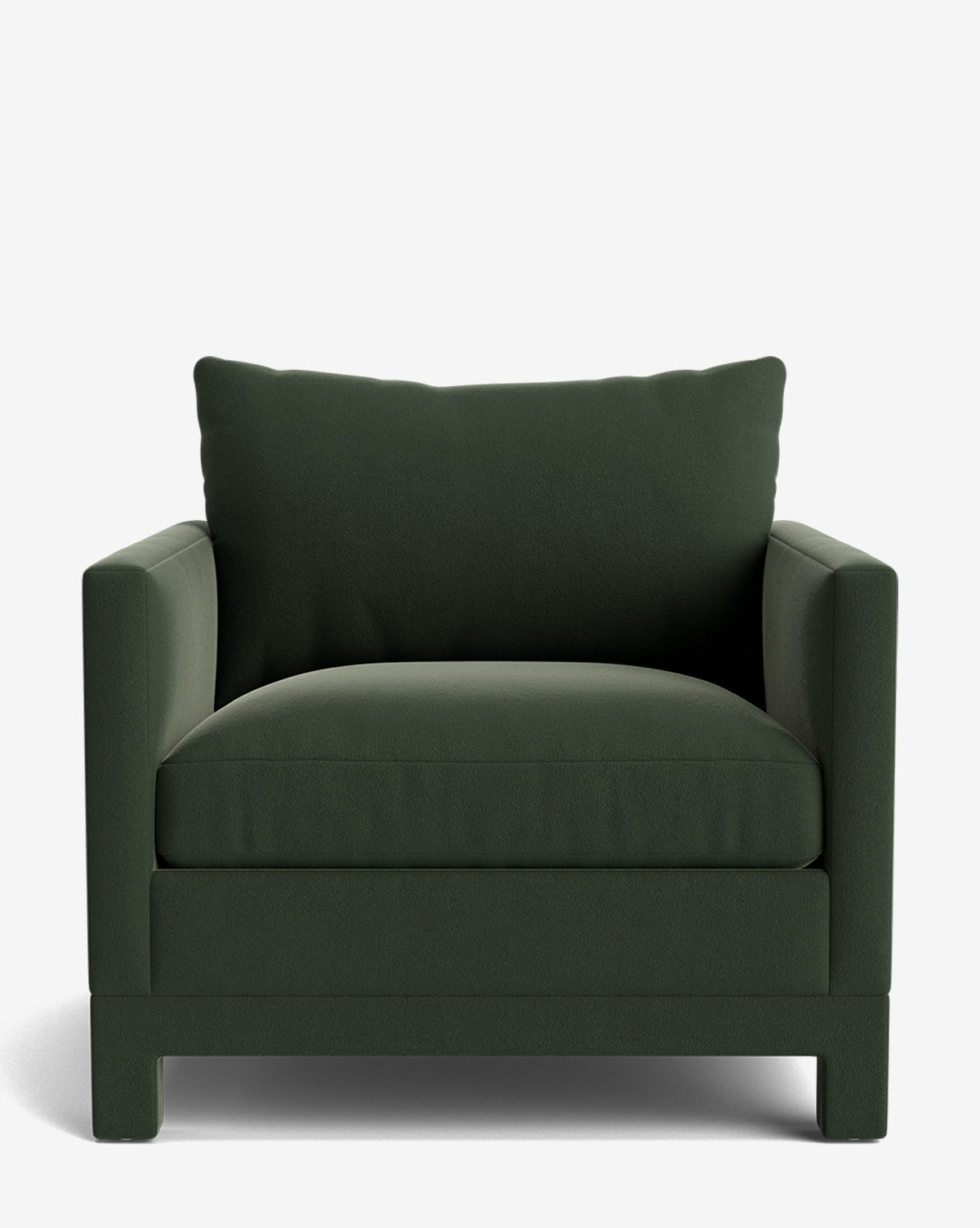 The Appoline Lounge Chair in dark green from our Upholstery Collection features wide arms, a thick seat cushion, and a plush back pillow. Made to order, its shown against a plain white background for a modern look by McGee & Co.