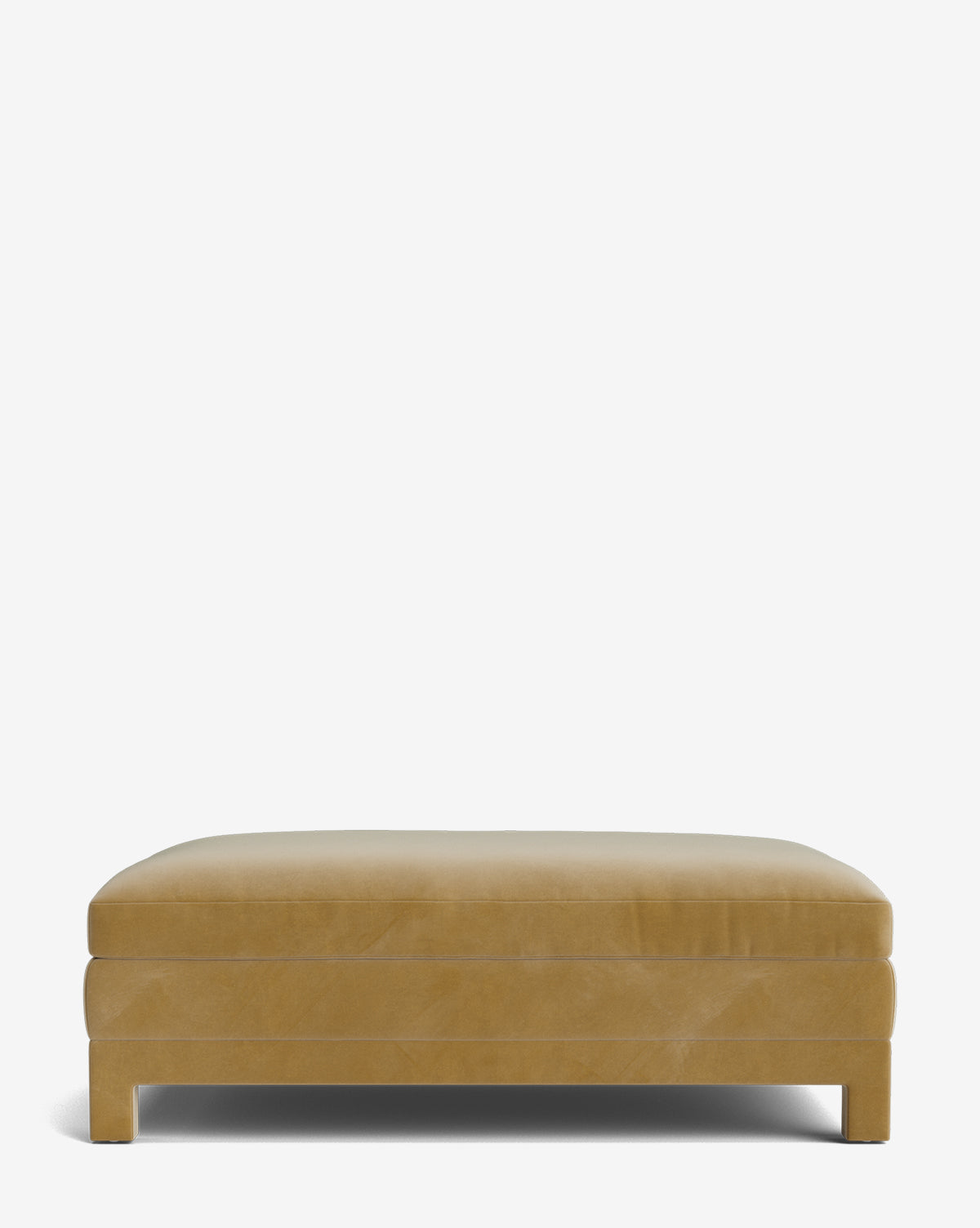 The Appoline Ottoman is a rectangular, light brown upholstered piece with a flat cushioned top and short block-style legs, displayed against a plain white background by McGee & Co.
