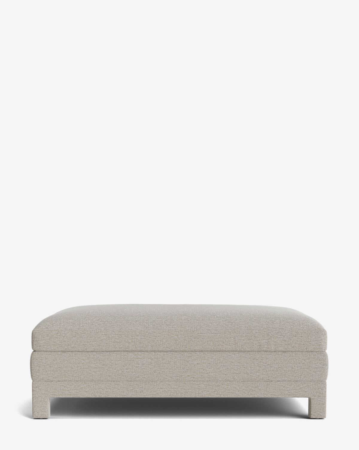The Appoline Ottoman features a minimalist rectangular design with light beige upholstery and short legs, displayed against a plain white background, by McGee & Co.
