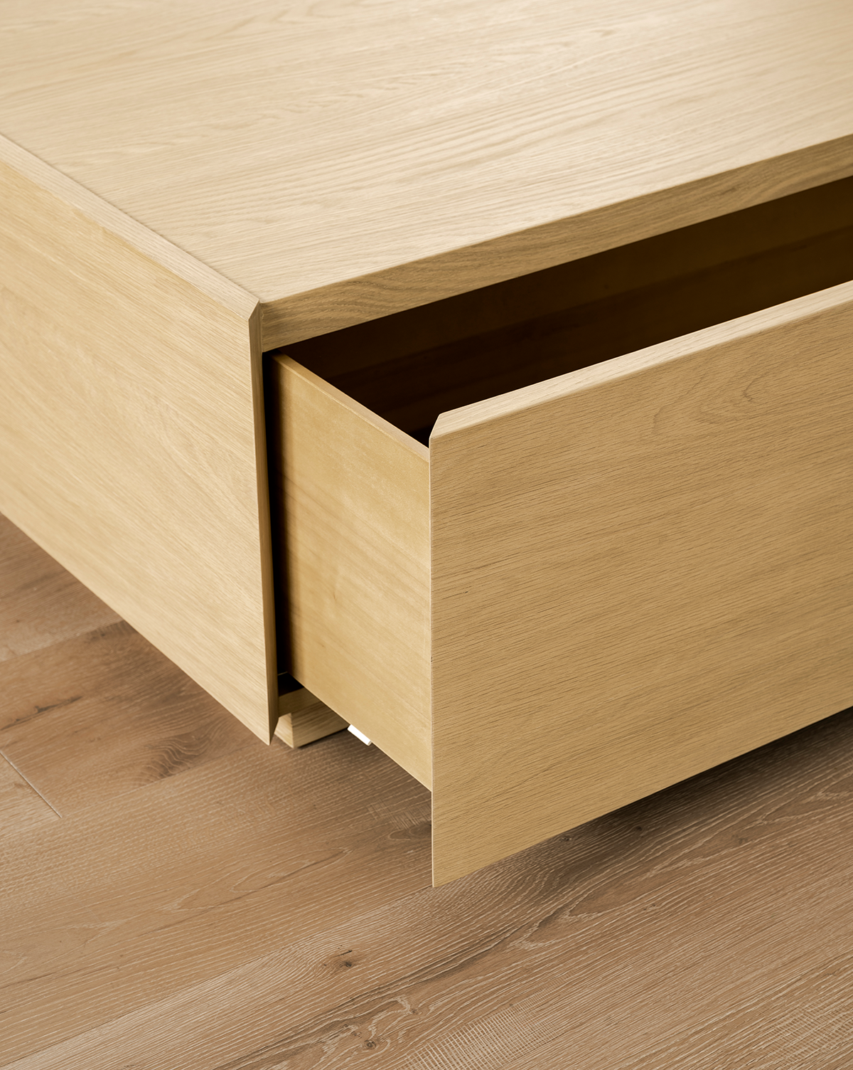 The handle-free, minimalist design perfectly complements the modern Bentley Coffee Table aesthetic, by McGee & Co.