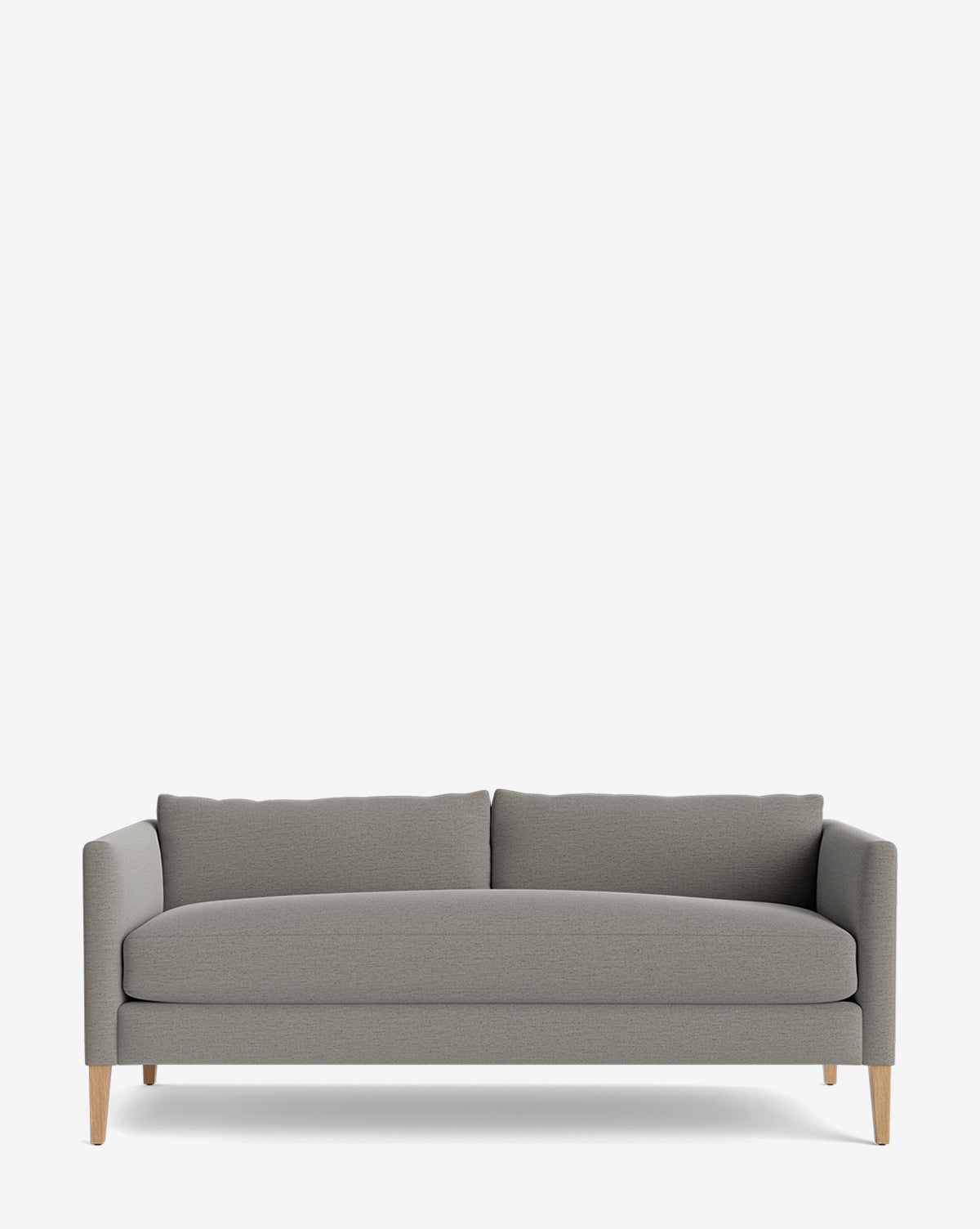 The Cade Sofa 80 is a modern, light gray down-wrapped sofa with straight arms, wooden legs, and two back cushions, shown against a plain white background by McGee & Co.