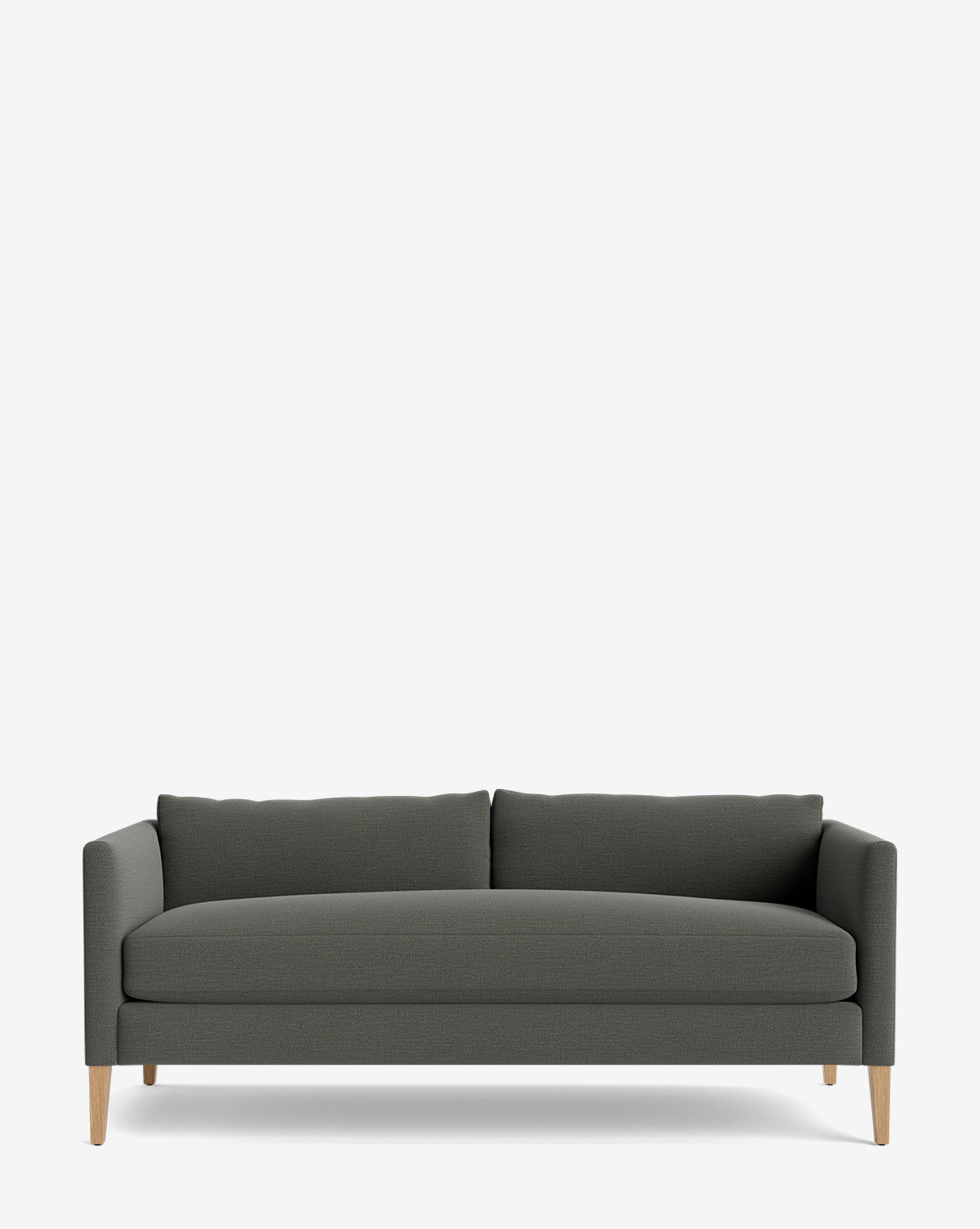 The Cade Sofa 80 in dark gray upholstery features slim, straight arms and light wooden legs. With two back cushions and a down-wrapped finish, this minimalist sofa provides contemporary comfort against a plain white background by McGee & Co.