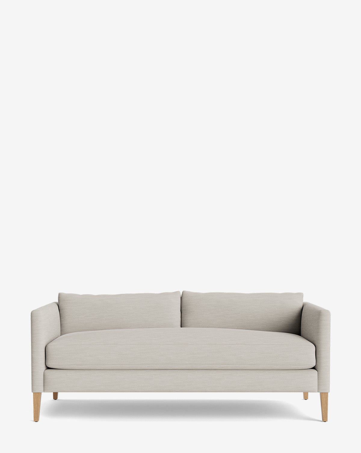 The Cade Sofa 80 features a modern design with light gray upholstery, wooden legs, straight arms, and two down-wrapped back cushions, shown against a plain white background by McGee & Co.