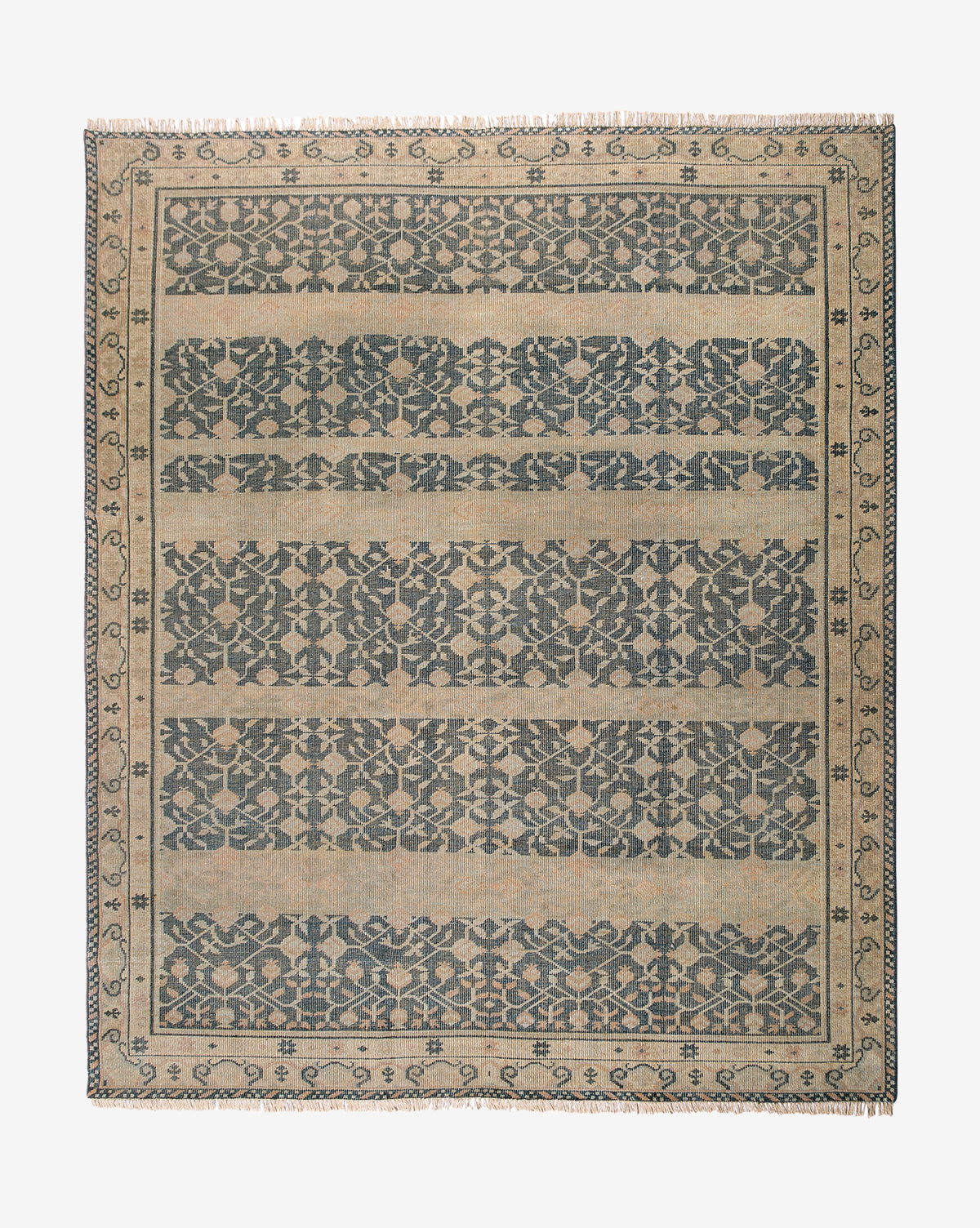 The Campanella Hand-Knotted Wool Rug is rectangular, with a beige background and dark blue floral and geometric patterns in horizontal bands, framed by a border that highlights artisan details inspired by traditional textiles, by McGee & Co.
