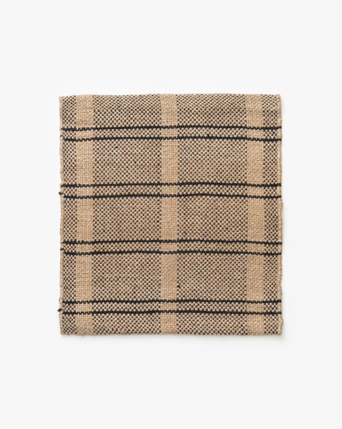 The Carlisle Handwoven Indoor/Outdoor Rug Swatch features a beige base with black and tan plaid, shown flat on a white background—ideal for adding natural style to your space, by McGee & Co.
