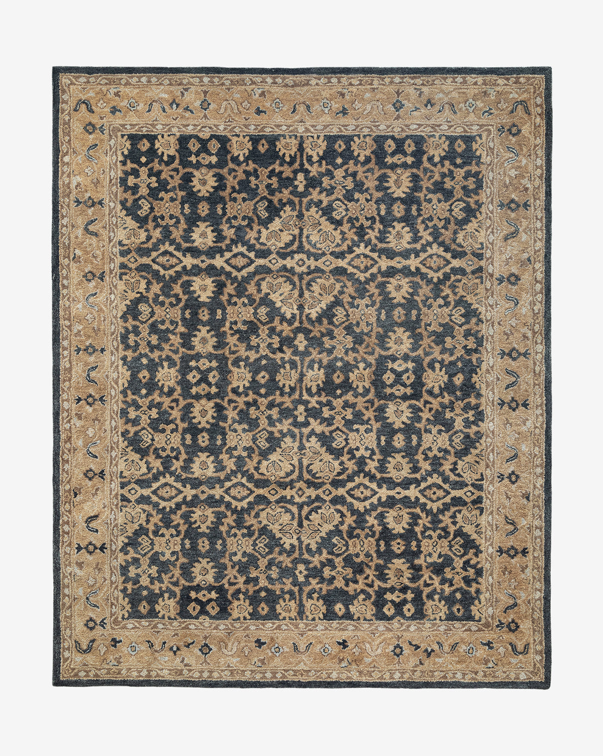 The Chandler Hand-Tufted Wool Rug showcases intricate floral and geometric designs in dark blue and beige, accented by a wide beige border with traditional motifs and artisan details, by McGee & Co.