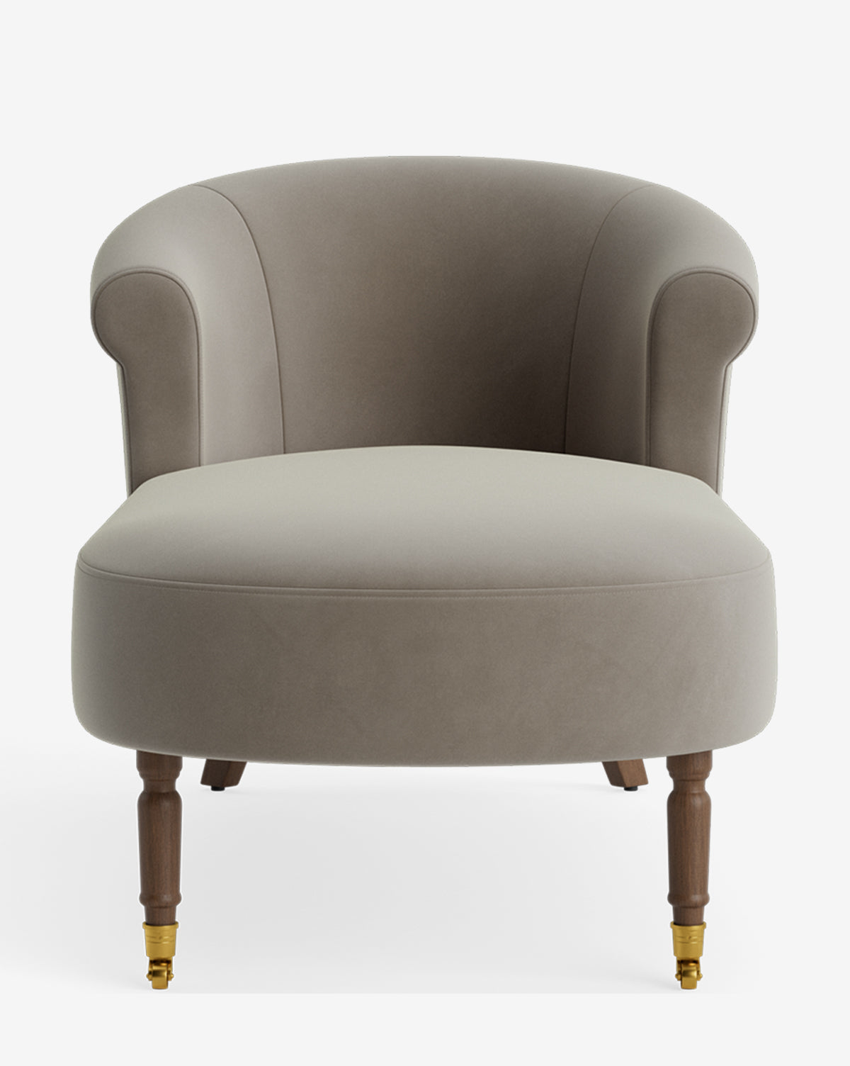 The Clemence Chaise is a modern, taupe accent chair with a rounded backrest, wooden legs, and front brass casters—ideal for customizable furniture enthusiasts. Displayed against a plain white background by McGee & Co.