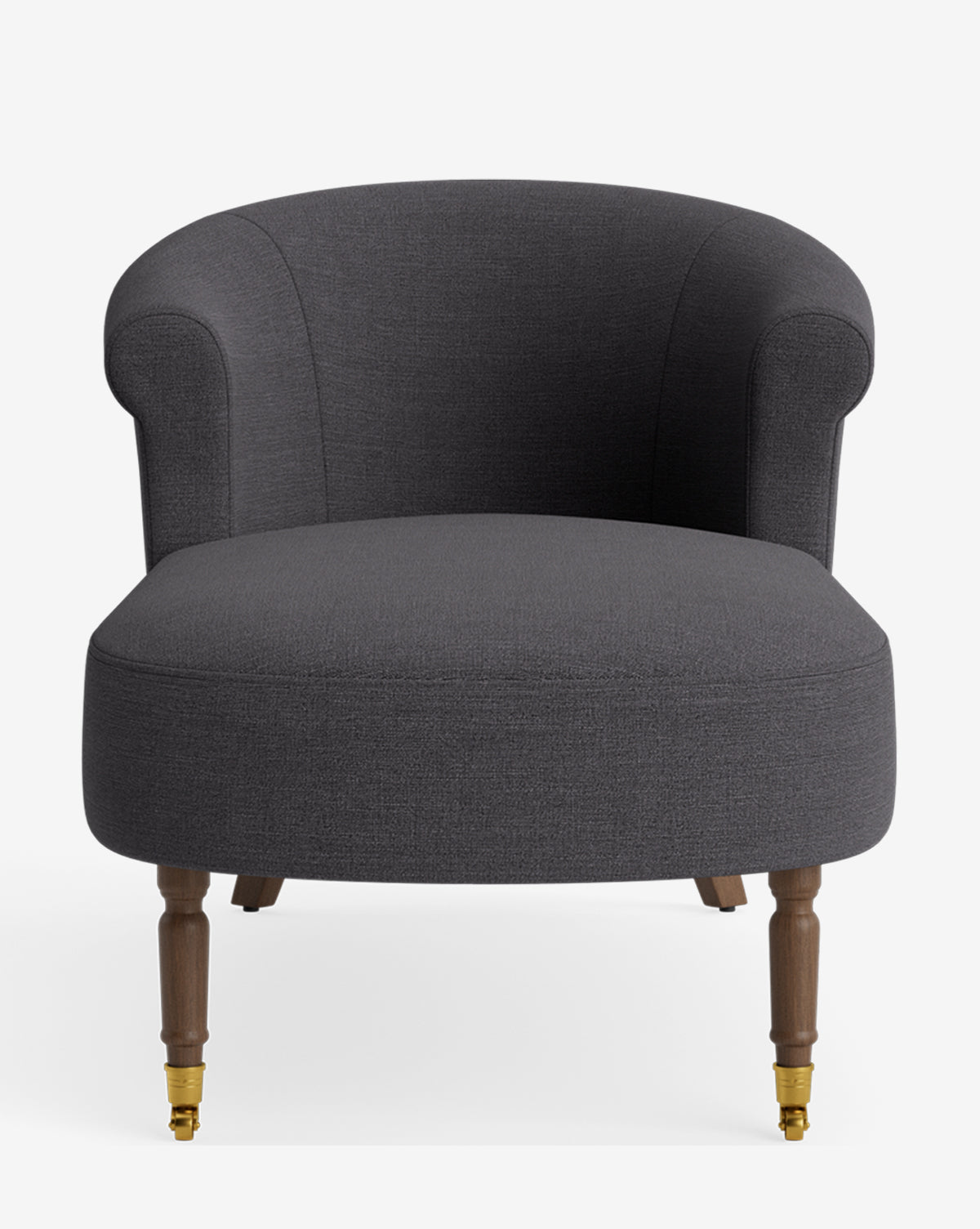 The Clemence Chaise, upholstered in dark gray, features a curved backrest, rounded arms, and wooden legs—two with brass casters—combining timeless style and customizable comfort. It is pictured against a plain white background by McGee & Co.