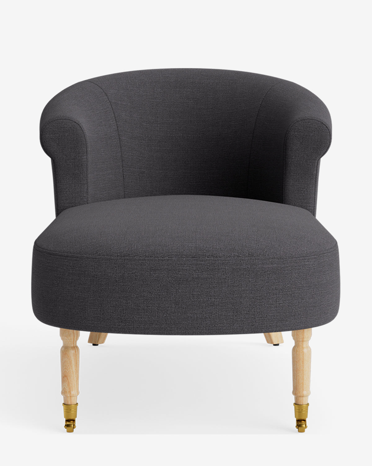 The Clemence Chaise features dark gray upholstery, a rounded backrest, and light wooden legs—two with wheels—blending modern style with classic lounge elegance for customizable decor against a plain white background, by McGee & Co.