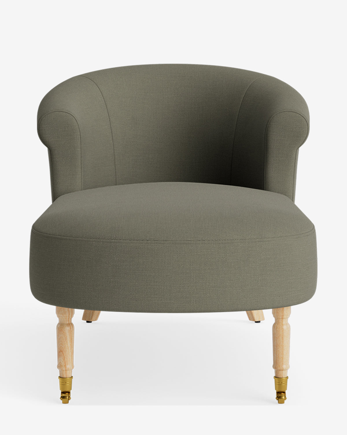 The Clemence Chaise is an olive green upholstered accent chair with a rounded back, curved arms, wooden front legs with brass casters, and simple rear legs—modern and minimalistic for customizable furniture collections, by McGee & Co.