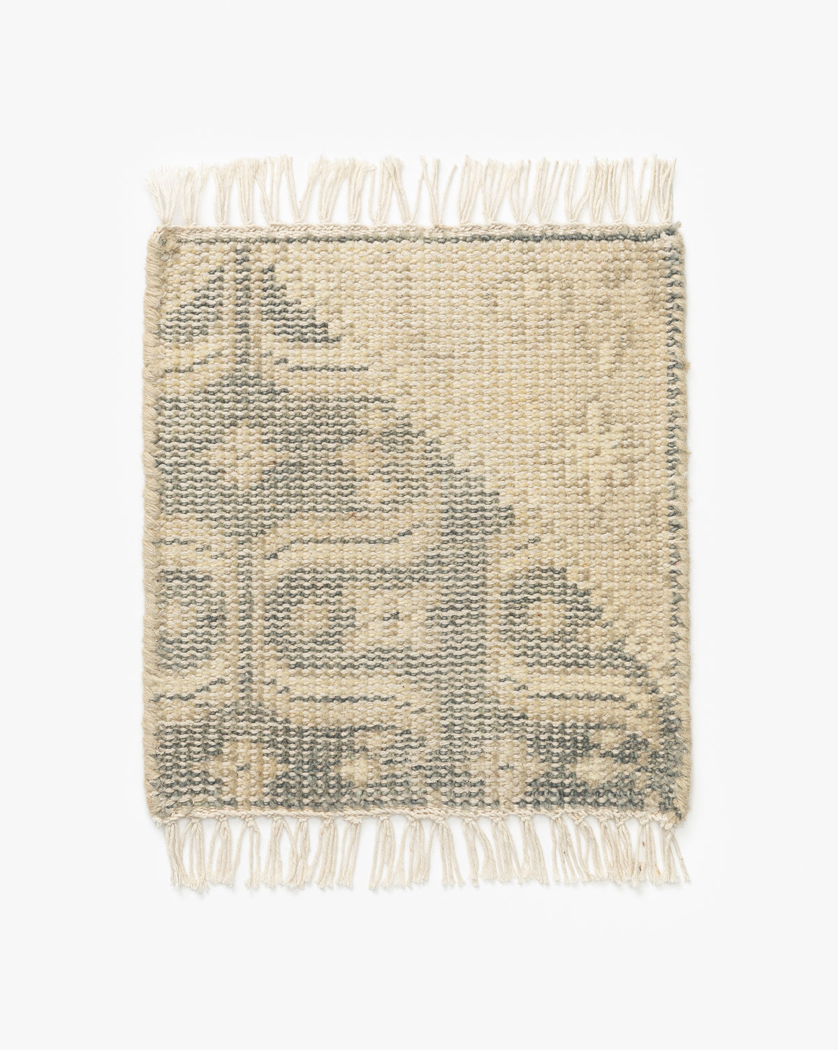 The Elin Hand-Knotted Rug Swatch is a square woven sample with fringed edges, artisan details, and beige and gray geometric patterns on a white background, inspired by traditional textiles, by McGee & Co.