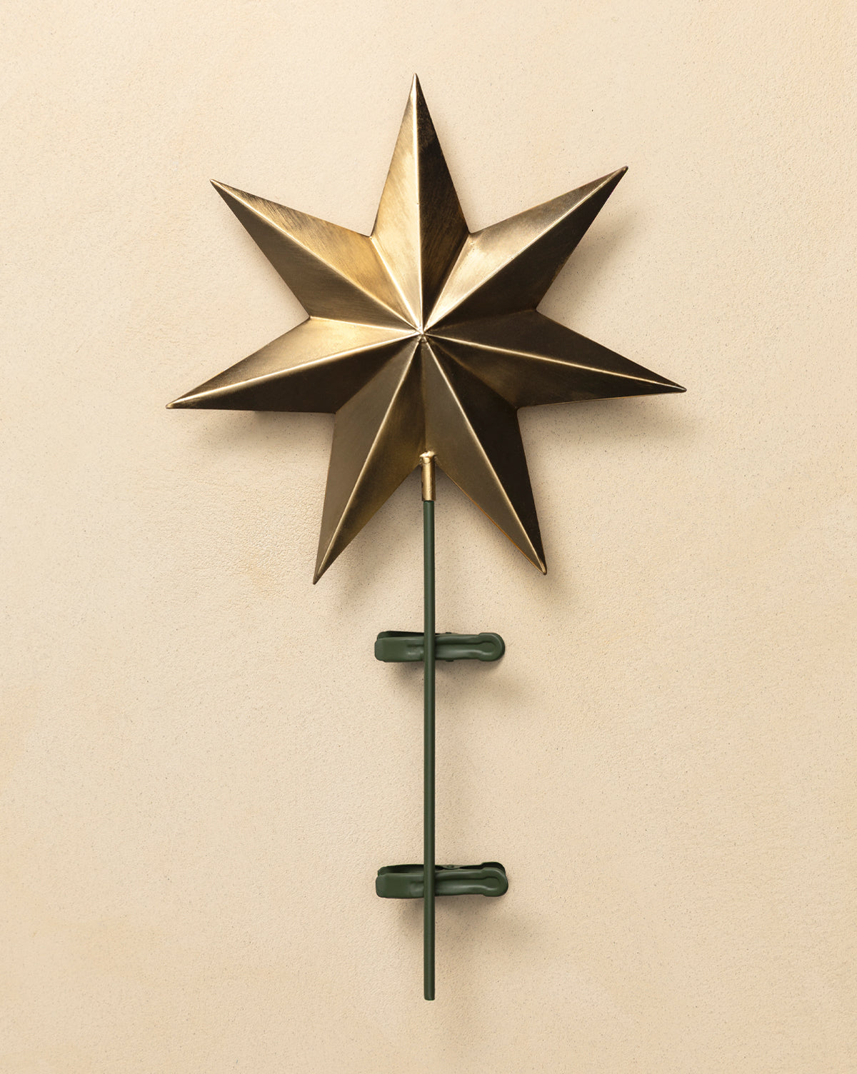 Displayed against a beige background, it’s the perfect touch of elegance for your holiday tree, by McGee & Co.