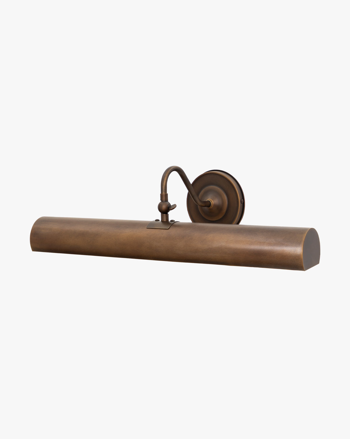 The Gallery Picture Sconce, a wall-mounted light with a curved arm and cylindrical shade in burnished bronze, is perfect for highlighting artwork or photos with its vintage-inspired style, by McGee & Co.