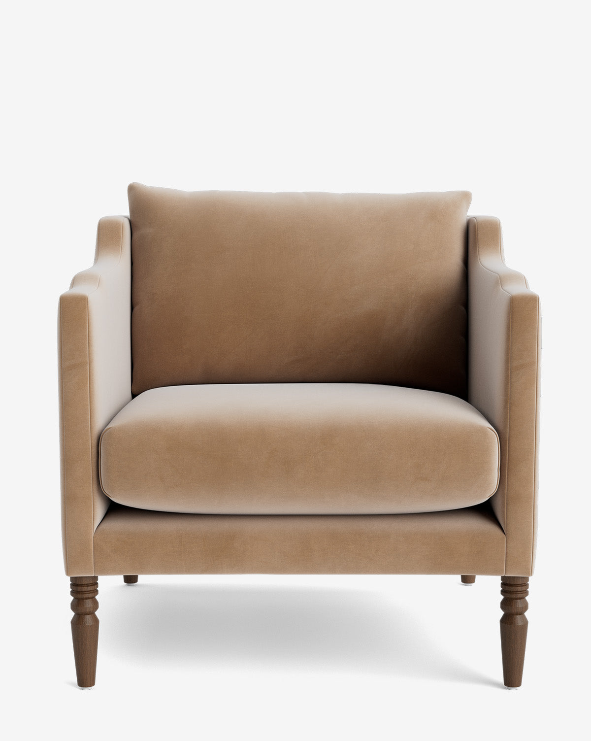 The Gemma Lounge Chair (Ready to Ship) is a modern armchair with plush seat and back cushions, straight arms, and four carved wooden legs, upholstered in high-quality light brown velvet, shown against a white background by McGee & Co.