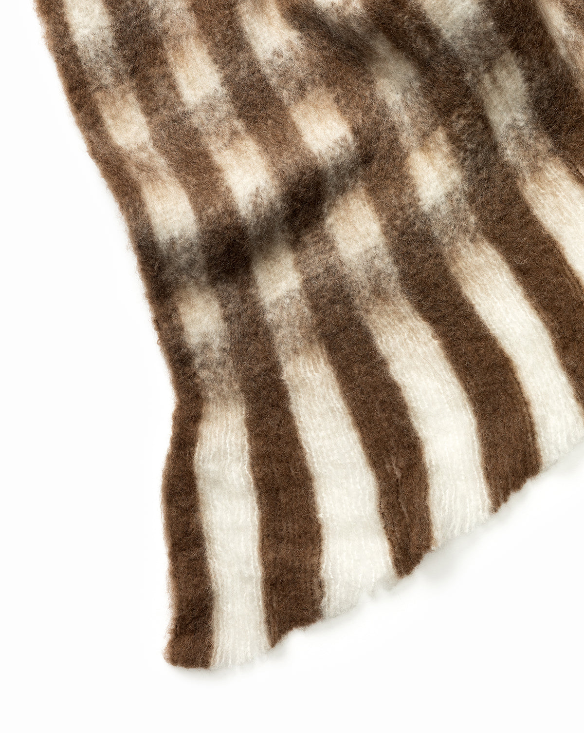 The Indaba Gingham Wool Blend Throw features a soft, fuzzy texture with vertical stripes in brown and white, displayed against a white background. McGee & Co.
