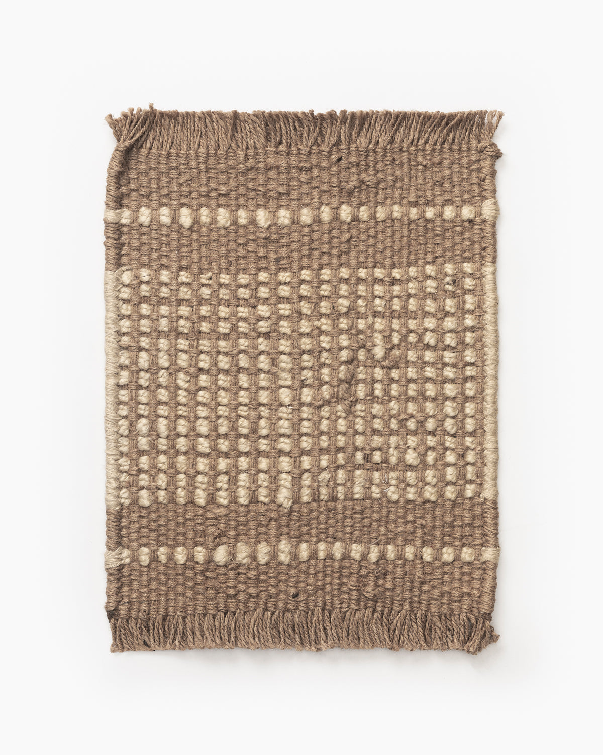 The Girona Natural Jute Rug Swatch is a rectangular, handwoven jute rug with a brown and beige checkered pattern, textured surface, and fringed edges on the shorter sides by McGee & Co.