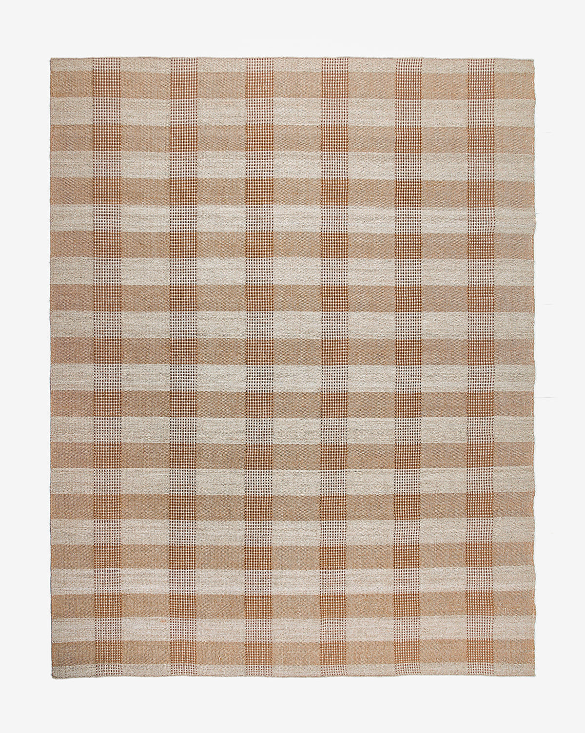 The Hargrove Handwoven Indoor/Outdoor Rug features a beige and light brown plaid checker pattern with evenly spaced stripes, shown on a white background.