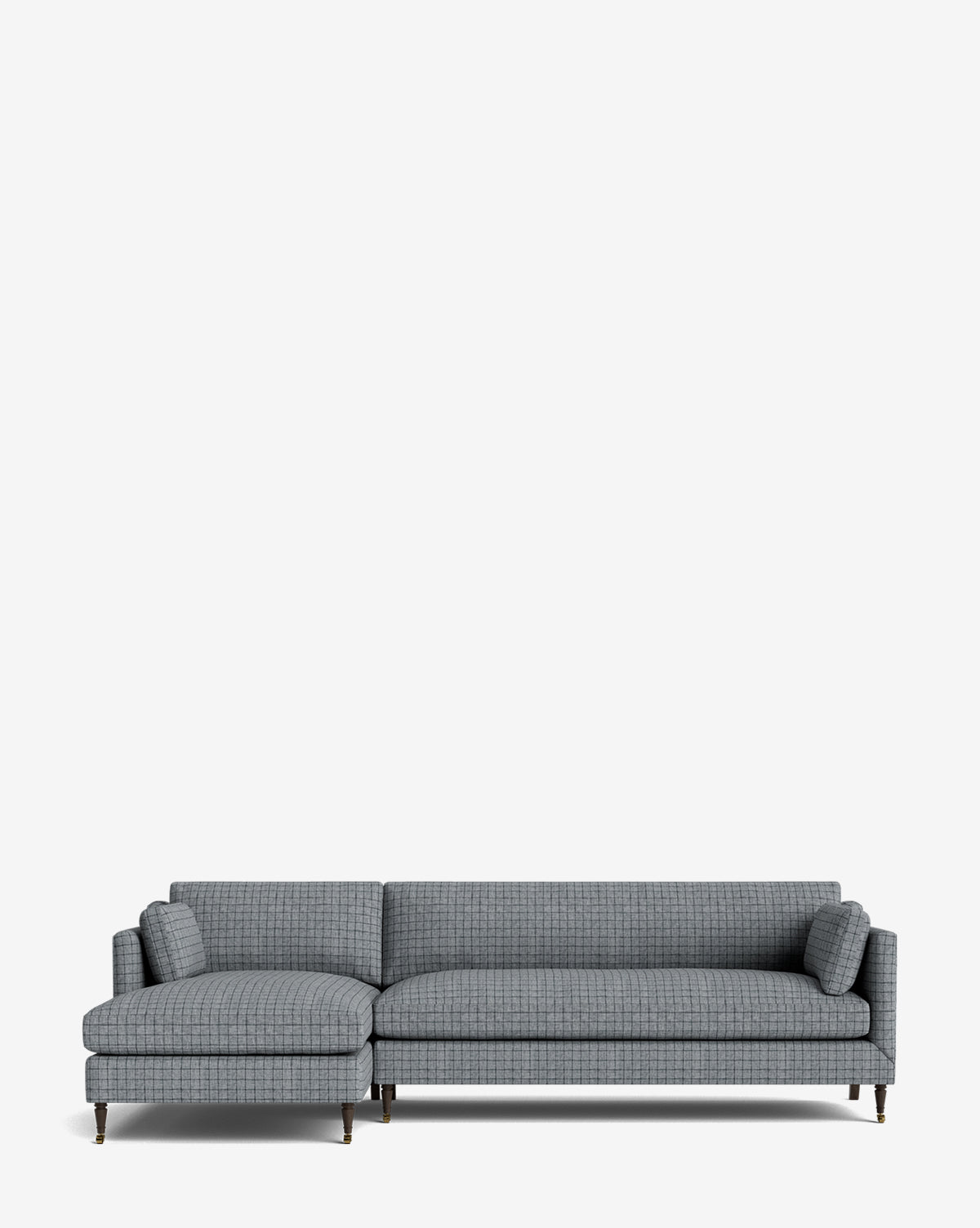 The Haverford Upholstered Left Chaise Sectional 113 features a modern design with a left-facing chaise, slim metal legs, and two cylindrical accent pillows, shown against a plain white background by McGee & Co.