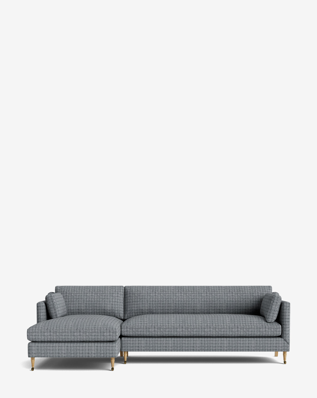 The Haverford Upholstered Left Chaise Sectional 113 features modern gray upholstery, a left-side lounge, thin gold legs, and two matching cylindrical pillows, shown against a plain white background by McGee & Co.