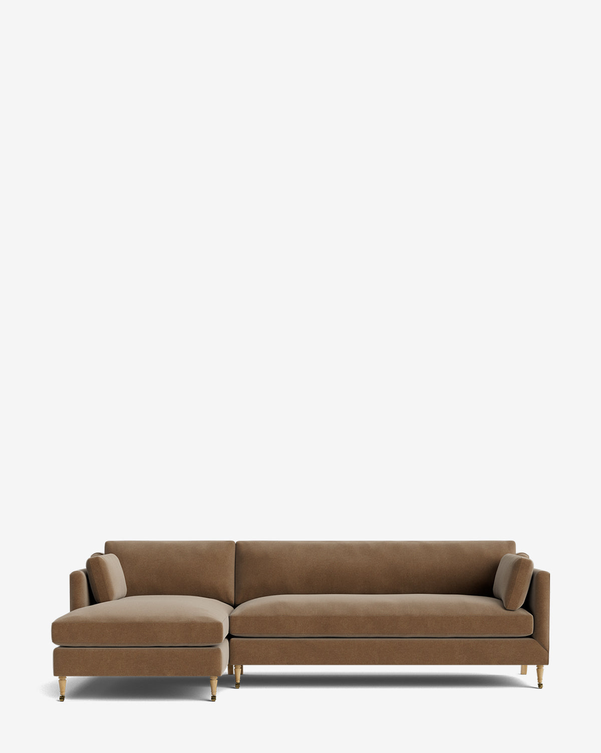 The Haverford Upholstered Left Chaise Sectional 113 is a modern brown customizable sofa with slim gold legs and two matching bolster pillows, shown against a plain white background, by McGee & Co.