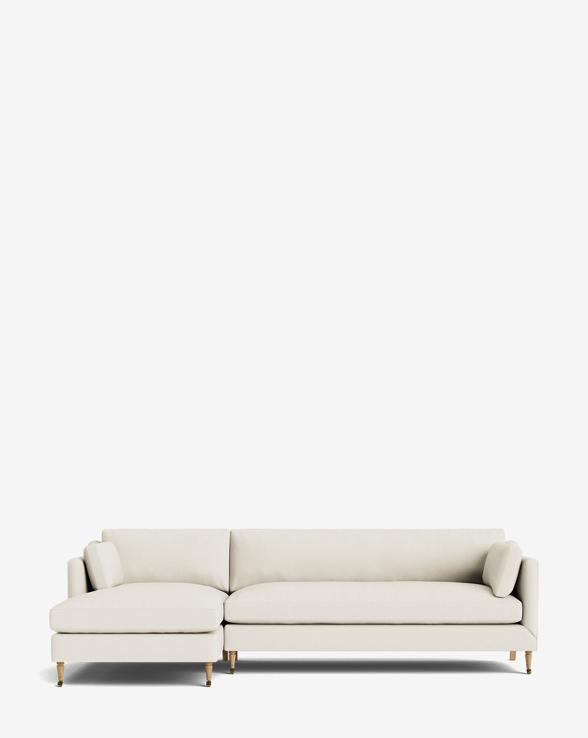 The Haverford Upholstered Left Chaise Sectional features slim cushions and gold-tipped wooden legs in light beige upholstery, shown against a plain white background by McGee & Co.