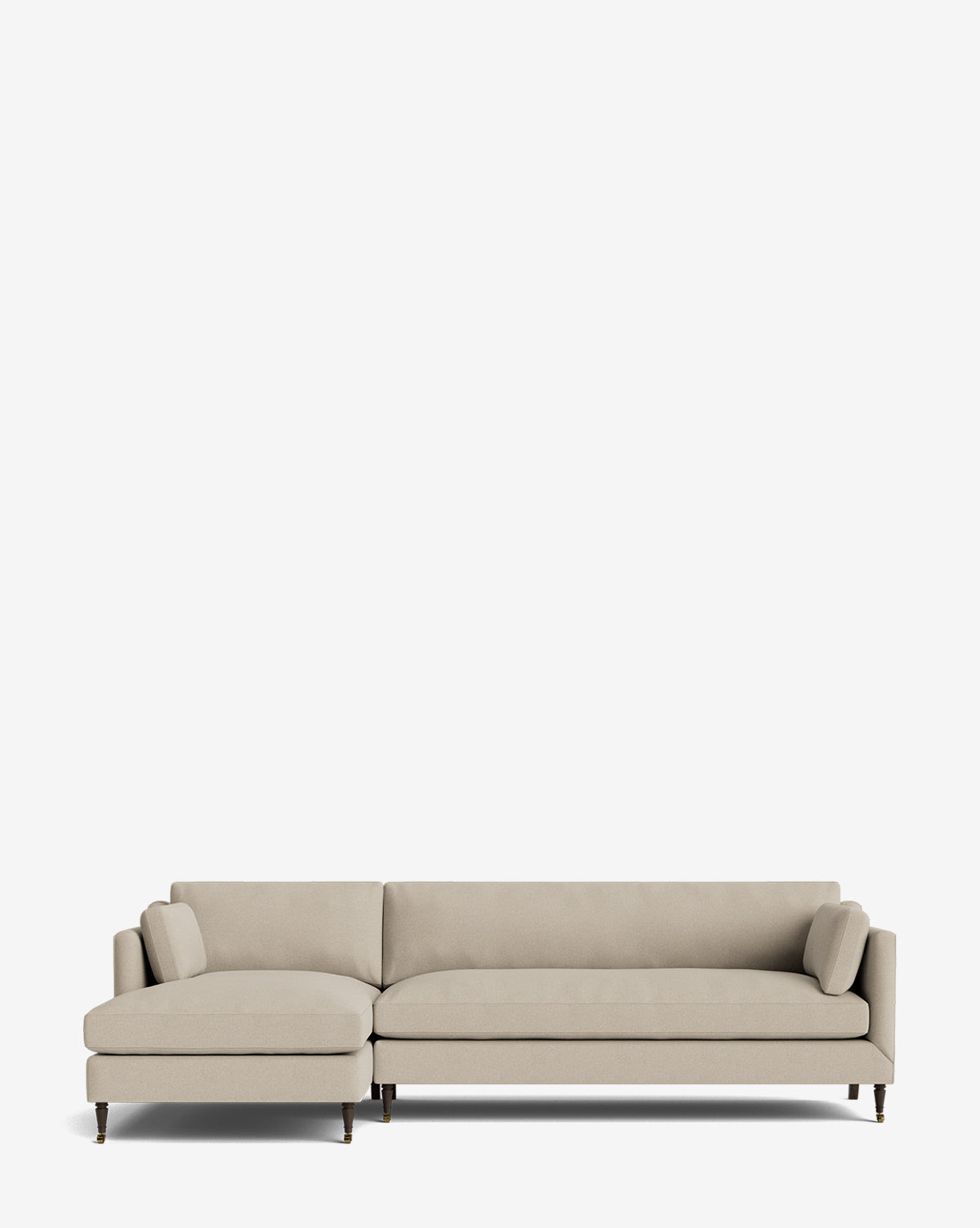 The Haverford Upholstered Left Chaise Sectional 113 is a modern beige sectional with a left-facing chaise, low backrest, two bolster cushions, and slim wooden legs, shown against a plain white background by McGee & Co.
