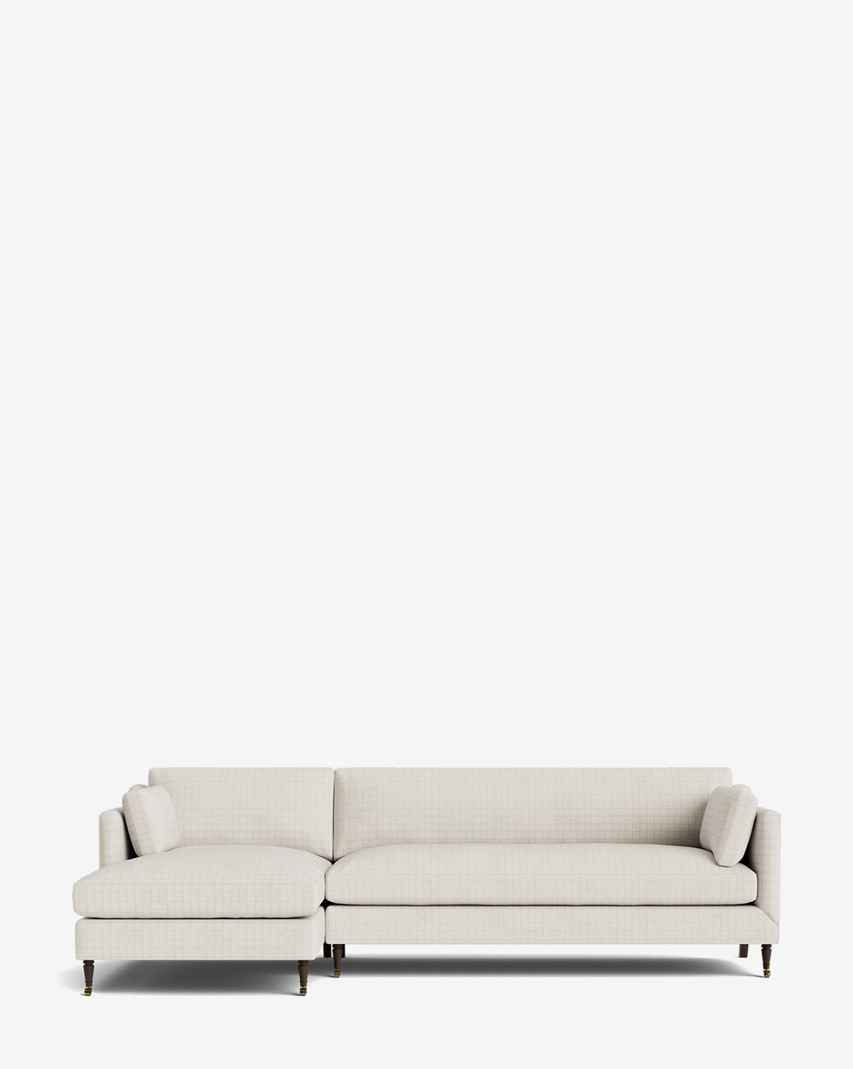 The Haverford Upholstered Left Chaise Sectional features a modern, light beige design with slim cushion armrests and two matching bolster pillows, shown on a plain white background, by McGee & Co.
