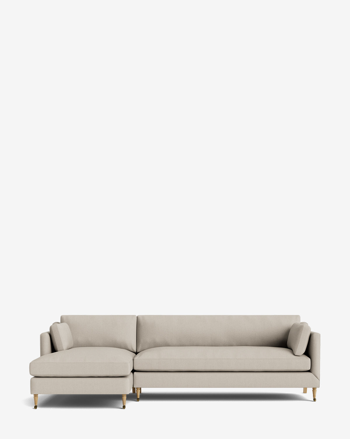 The Haverford Upholstered Left Chaise Sectional in light beige features slim cushions and short wooden legs, displayed against a plain white background, by McGee & Co.