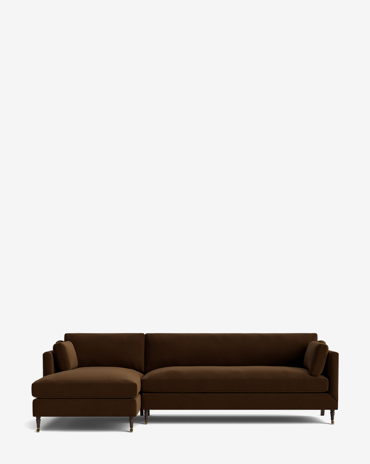 The Haverford Upholstered Left Chaise Sectional 113 is a modern, dark brown L-shaped sofa with slim metal legs and two bolster pillows, shown against a plain white background, by McGee & Co.