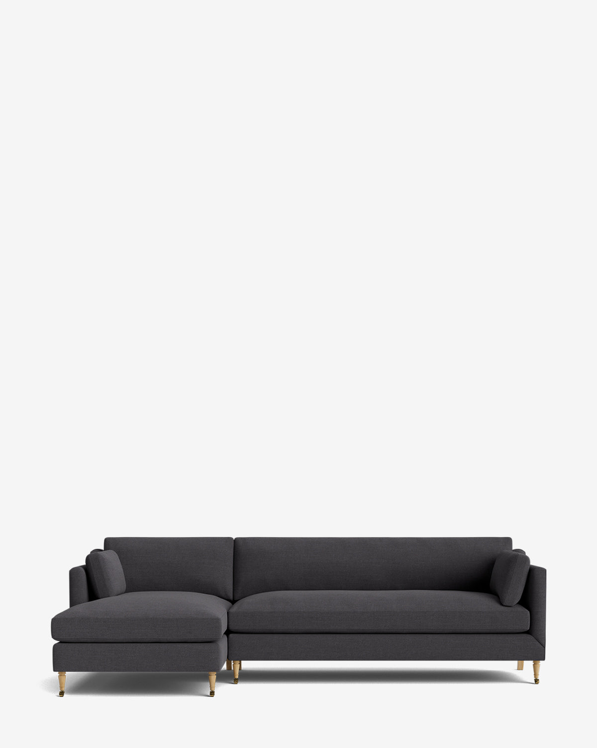 The Haverford Upholstered Left Chaise Sectional by Rowe Fine Furniture features a modern dark gray design, gold-tipped legs, and two matching cylindrical cushions on each end. Shown against a plain white background. McGee & Co.