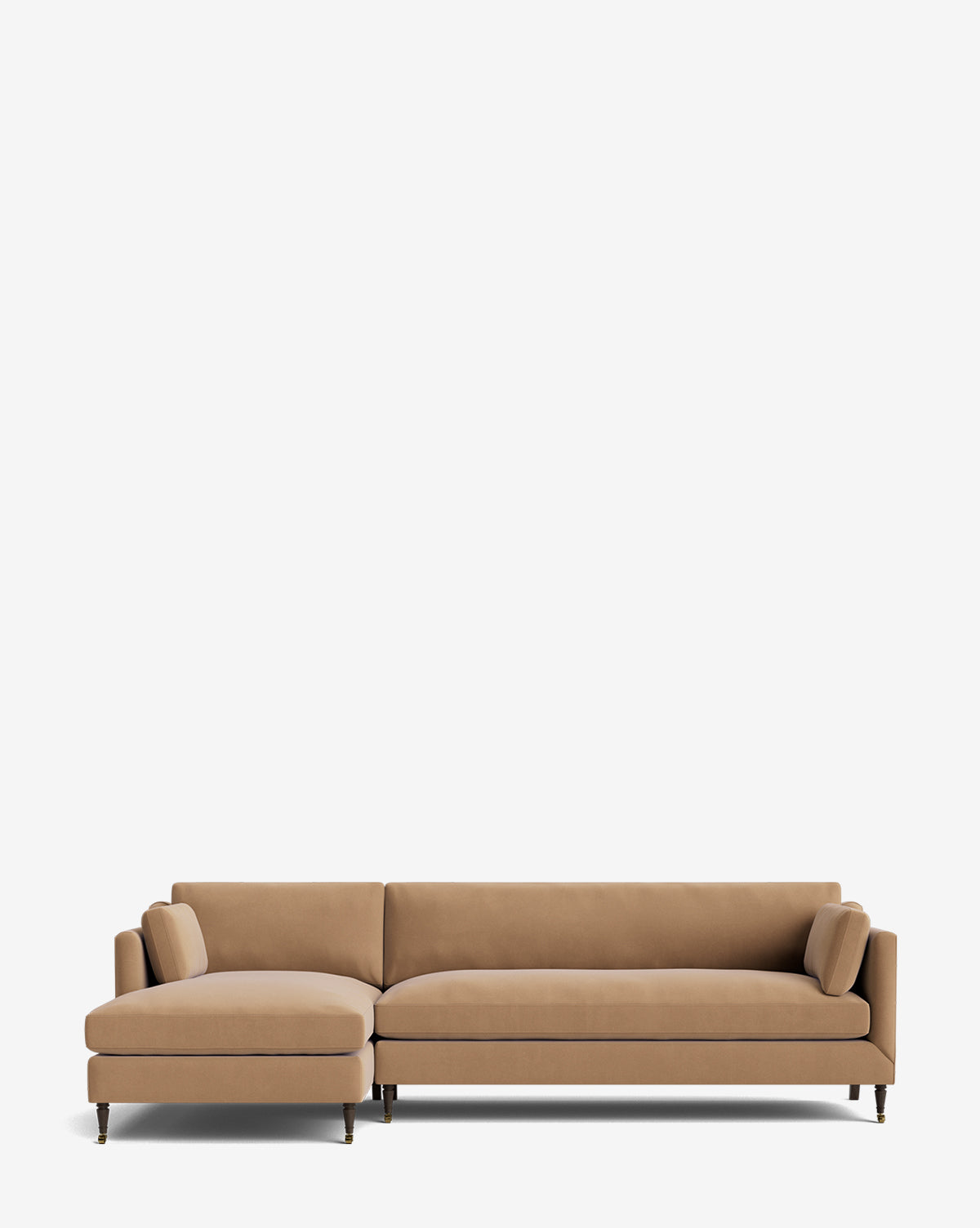 The Haverford Upholstered Left Chaise Sectional features a customizable tan design with slim cushions, matching bolster pillows, and thin black legs, displayed against a plain white background by McGee & Co.
