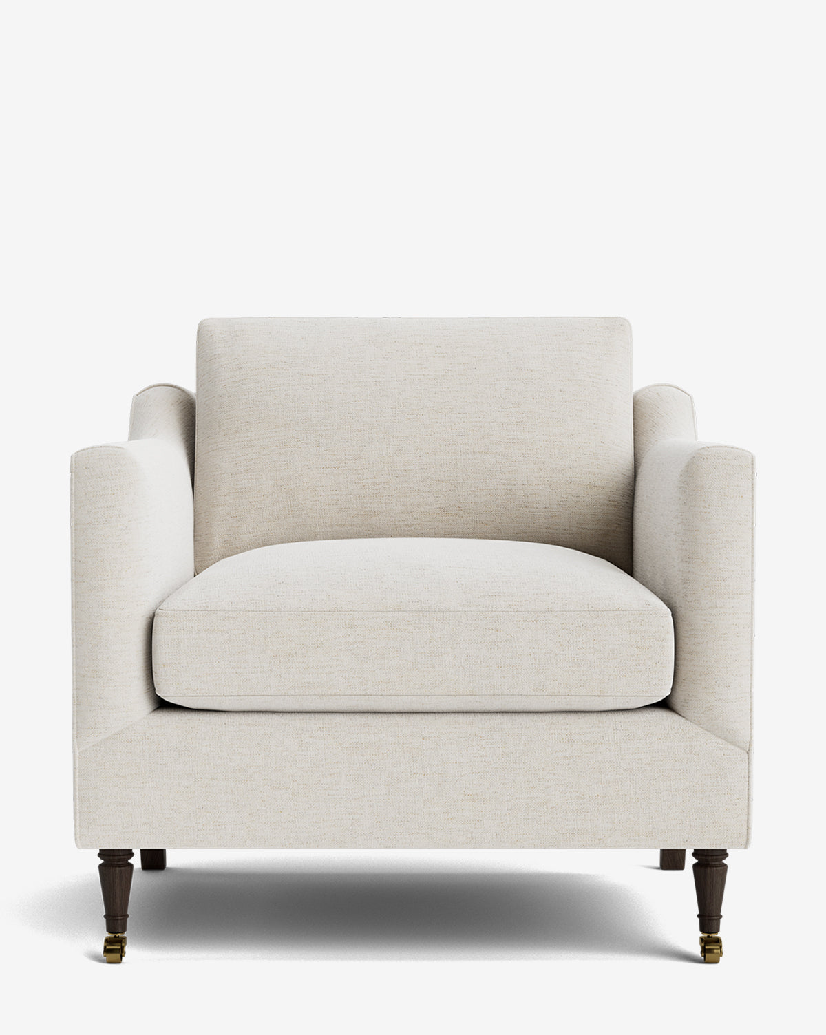The Haverford Upholstered Lounge Chair features a modern, cream-colored design with plush seat and back cushions, boxy lines, dark wooden legs, and two brass-castered feet, shown against a plain white background by McGee & Co.