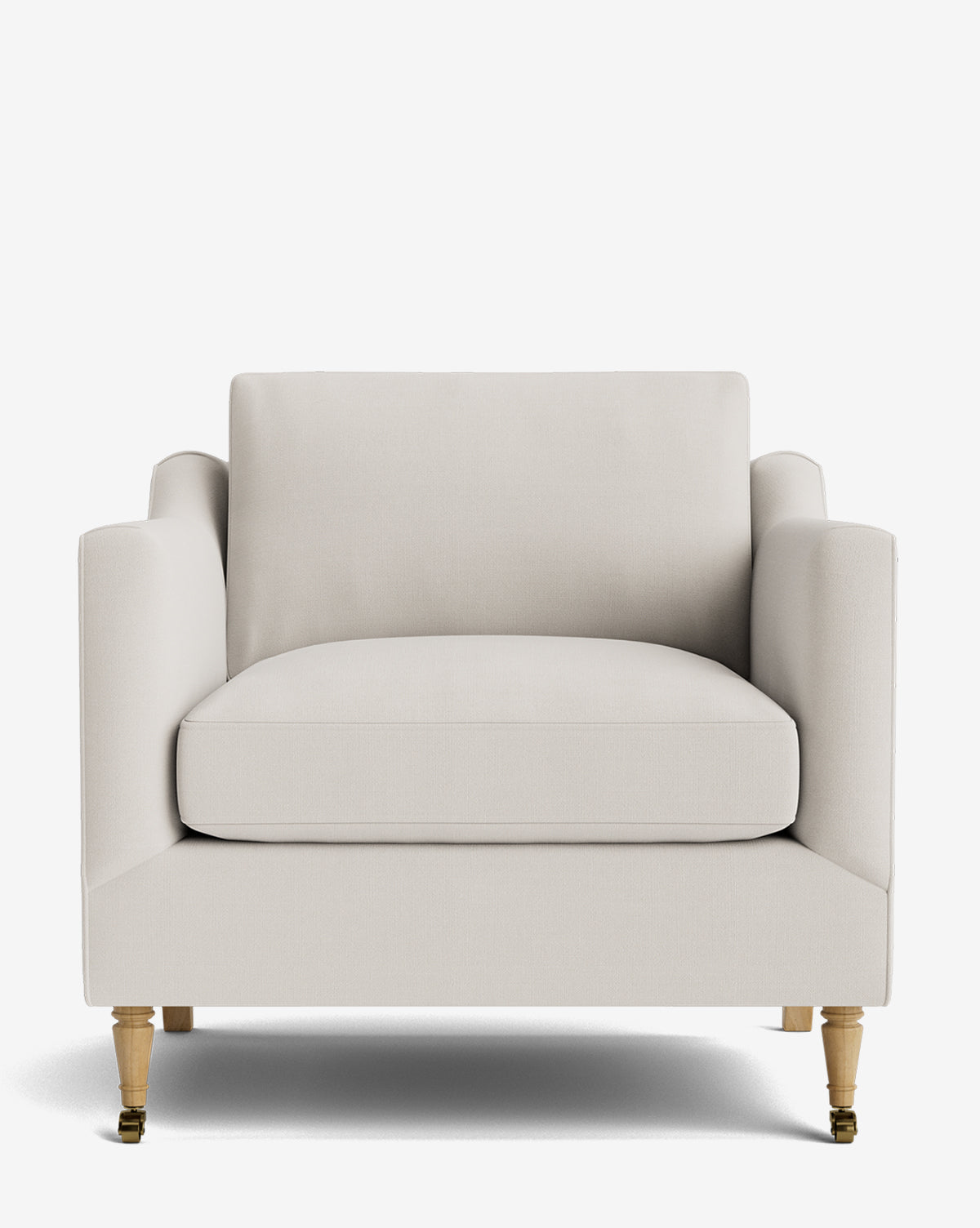 The Haverford Upholstered Lounge Chair features a modern cream design with square armrests and wooden legs, two accented by visible brass caster wheels, shown against a plain white background by McGee & Co.