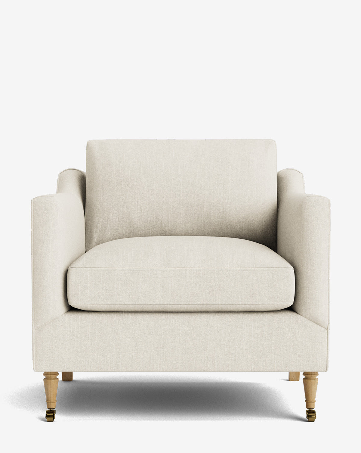A front view of the Haverford Upholstered Lounge Chair, featuring a modern cream-colored design with cushioned seat and backrest, straight arms, wooden legs, and two small brass casters on the front legs, by McGee & Co.