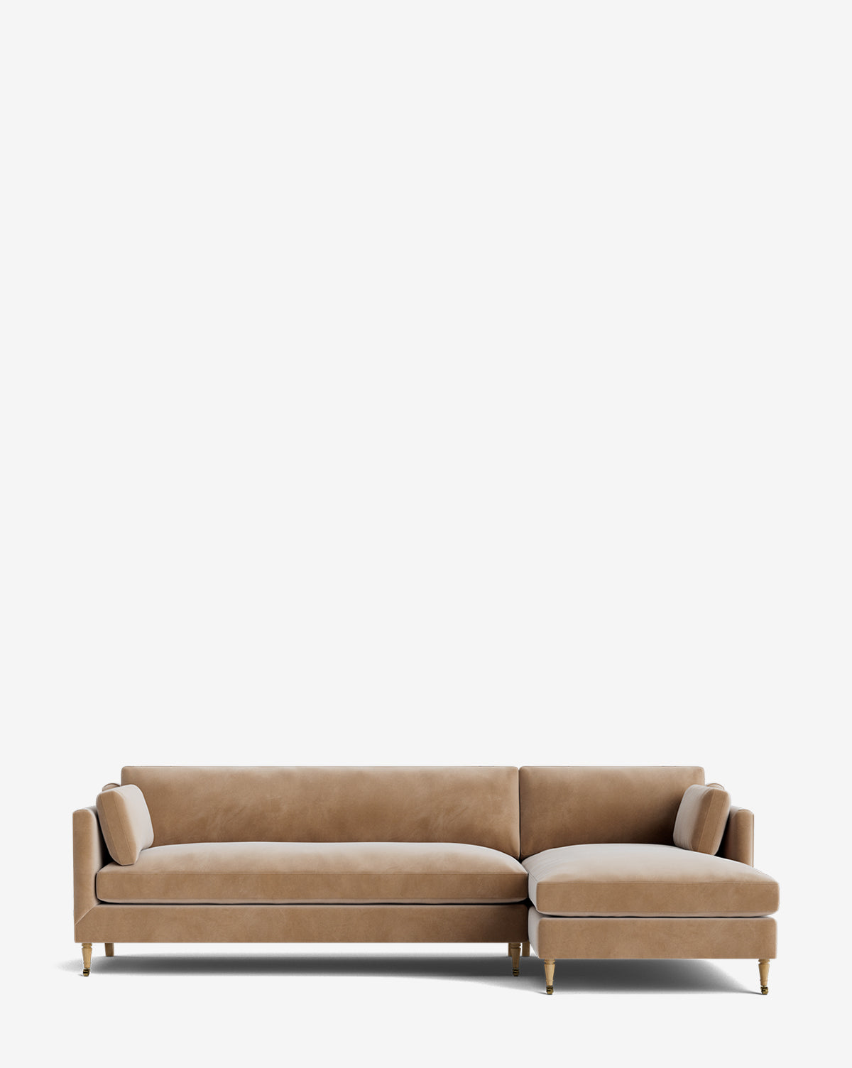 The Haverford Upholstered Right Chaise Sectional by Rowe Fine Furniture features light brown upholstery, two bolster pillows, slim straight arms, and tapered wooden legs with brass tips for a modern customizable look by McGee & Co.