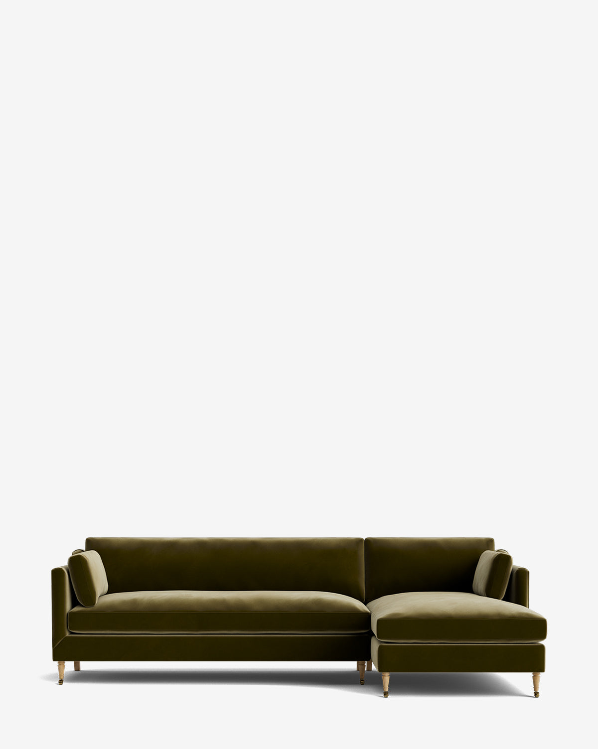The Haverford Upholstered Right Chaise Sectional 113 is a modern olive green velvet, made-to-order sofa with two cylindrical bolster pillows and wooden legs with gold-tone caps, shown on a plain white background by McGee & Co.
