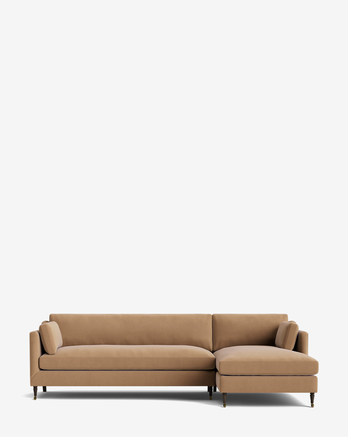 The Haverford Upholstered Right Chaise Sectional 113 is a tan, L-shaped sectional with wooden legs and two cylindrical side pillows, shown against a plain white background by McGee & Co.