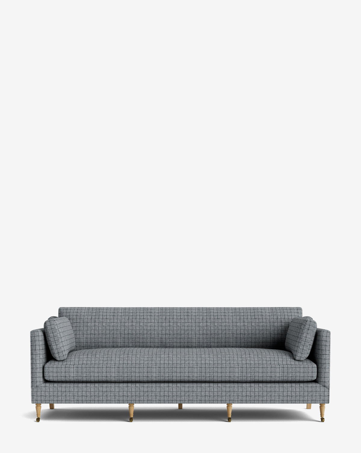 The Haverford Upholstered Sofa 90 features a modern gray checkered design, slim arms, two cylindrical bolster pillows, and six gold metal legs, shown against a plain white background by McGee & Co.