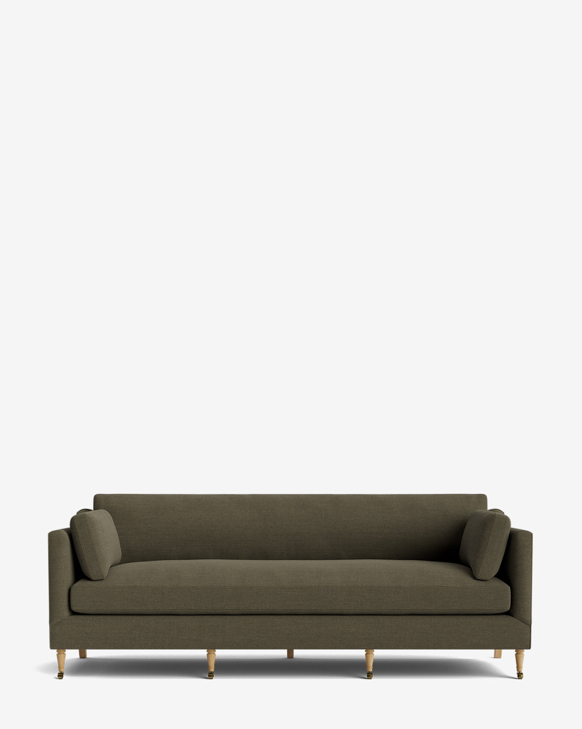 The Haverford Upholstered Sofa 90 is a modern olive-green handcrafted sofa featuring slim arms, two matching bolster pillows, and angled wooden legs with gold accents, displayed against a plain white background by McGee & Co.