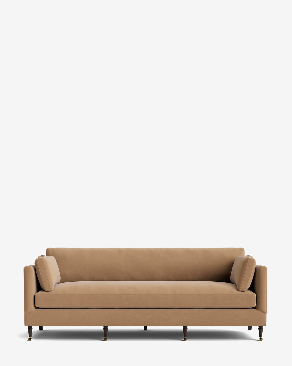 The Haverford Upholstered Sofa 90 is a tan velvet, handcrafted sofa with straight arms, two matching bolster pillows, and four wooden legs, pictured against a white background by McGee & Co.