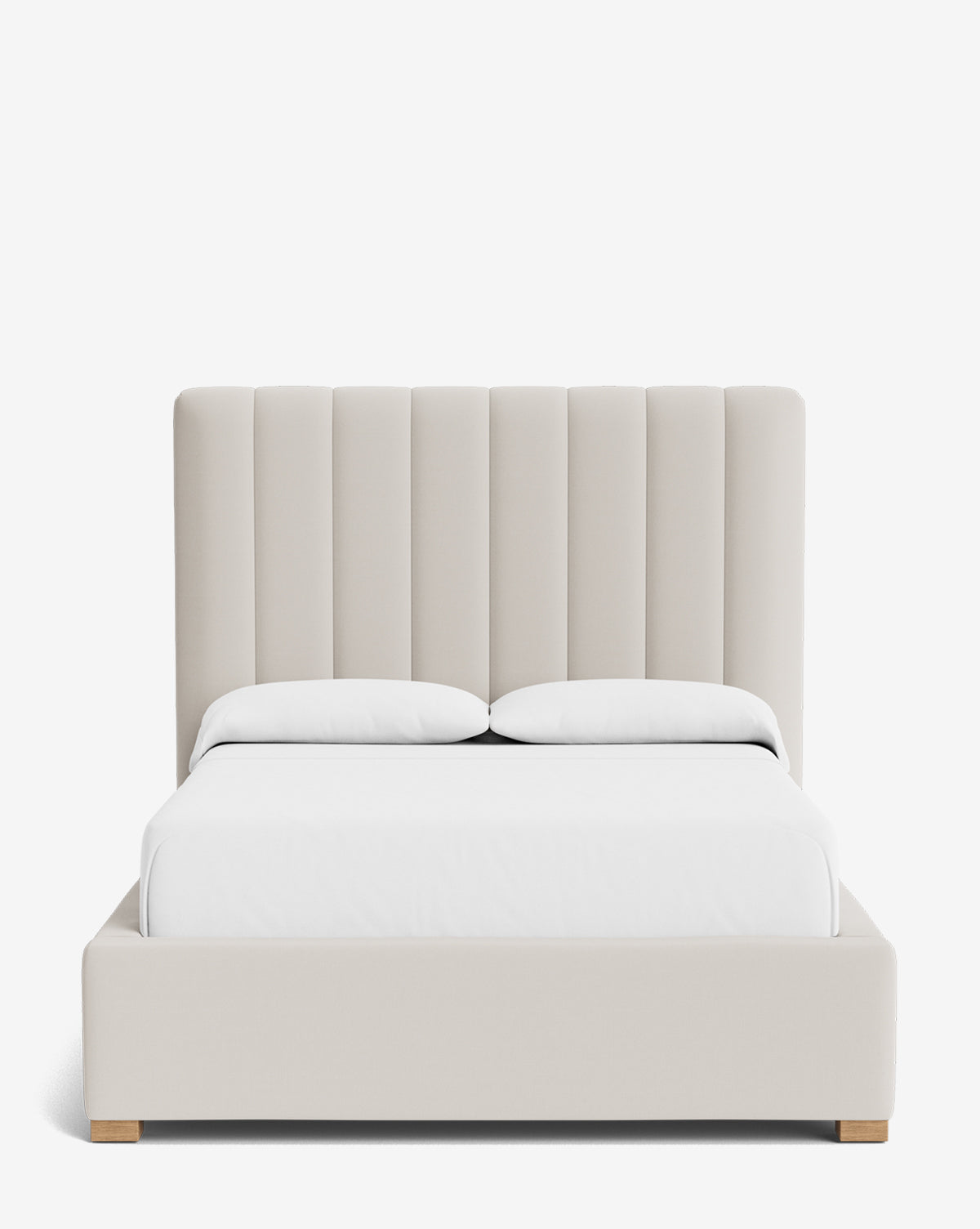 The Hoffman Bed Tall Headboard showcases a tall, vertically paneled headboard, white bedding, and light wooden legs against a plain white background. Available in customizable fabrics to match your style, by McGee & Co.