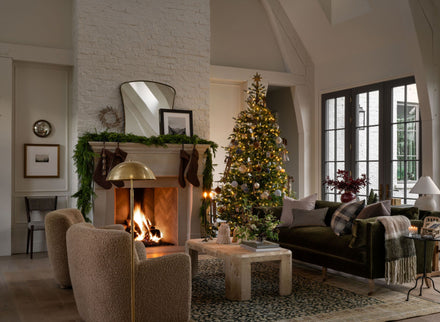 Reimagine the traditional elements of your living room with layers of holiday textiles, aromas, and decor to create a joyful gathering space throughout the season.