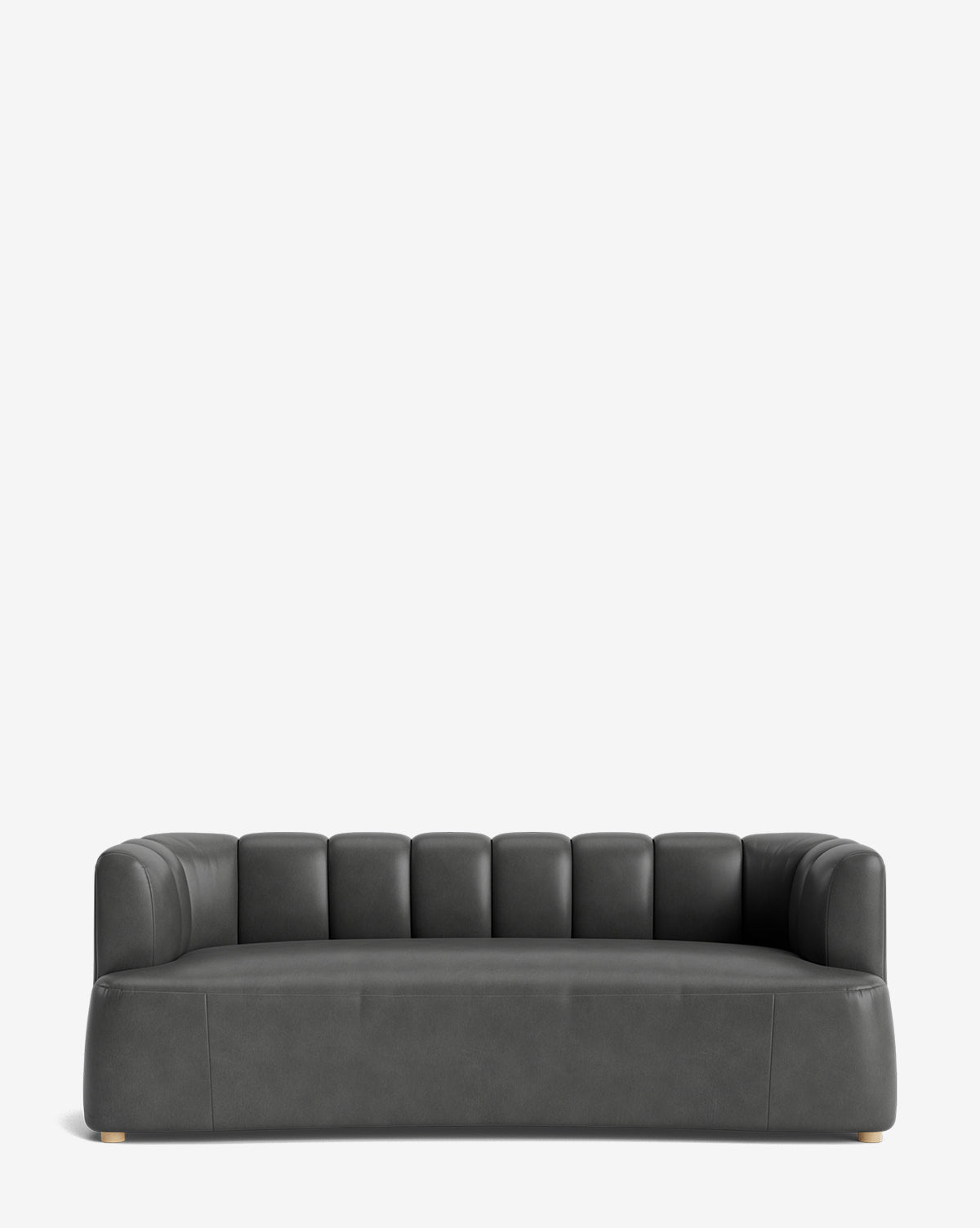 The Ines Sofa 90 is a modern dark gray velvet sofa with a low back, vertical tufting, rounded armrests, and wooden legs—perfect for adding chic elegance to any space, by McGee & Co.