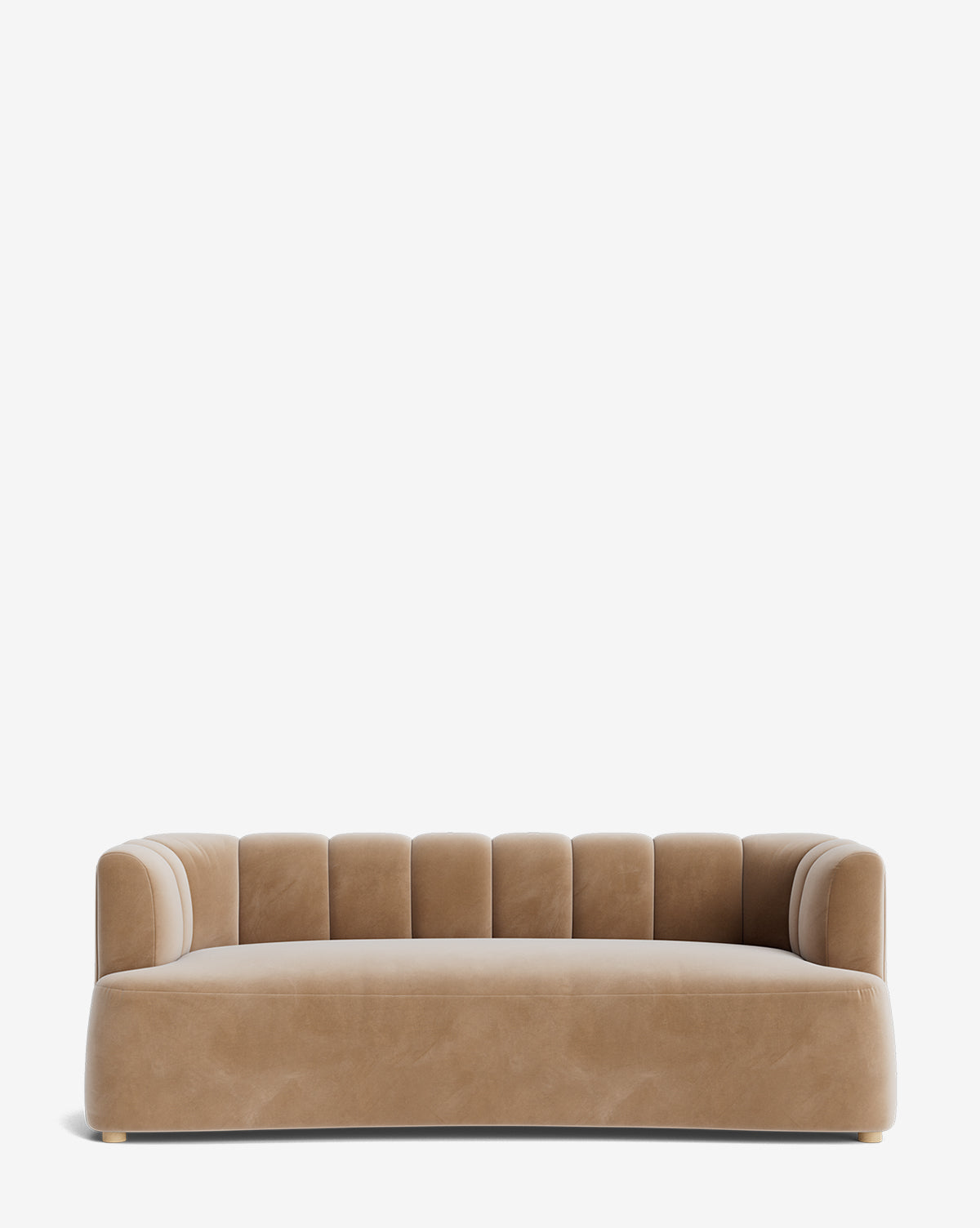 The Ines Sofa 90 is a modern tan velvet sofa with a curved backrest and vertical channel tufting, set on short wooden feet against a plain white background, by McGee & Co.