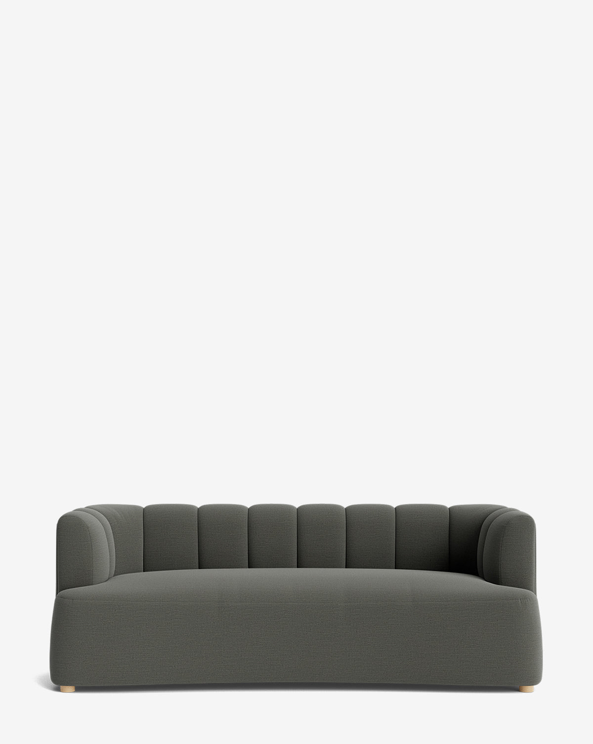 The Ines Sofa 90 is a modern, dark gray velvet sofa with a low backrest and rounded, channel-tufted design. It features a wide seat, small light-colored feet, and is displayed against a plain white background by McGee & Co.