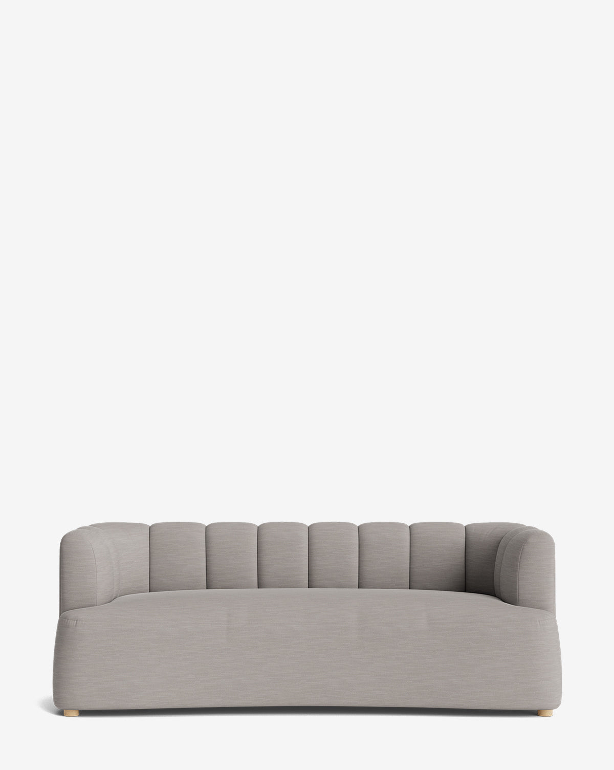 The Ines Sofa 90 showcases a modern design with light gray velvet upholstery, a low backrest, rounded arms, and vertical channel tufting on its back and sides. Small light wooden feet add elegance against a plain white background by McGee & Co.